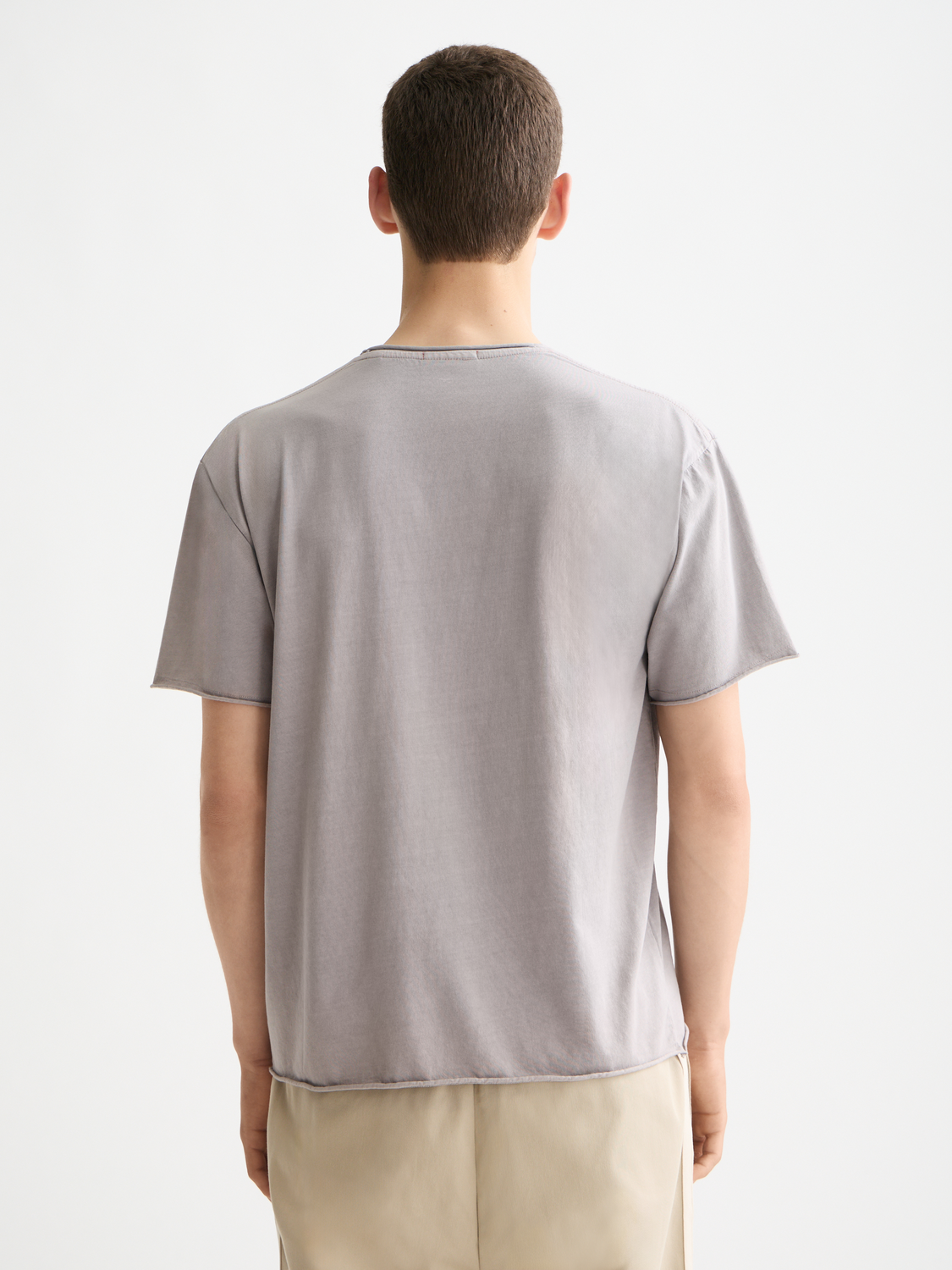 Raw edge Scotch & SODA short sleeve t-shirt displayed on a hanger with a casual fit and distressed neckline detail.