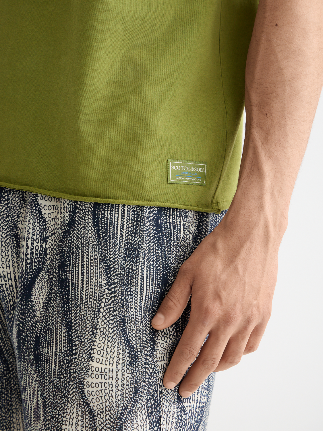 Light gray raw edge short sleeve t-shirt by Scotch & Soda, showcasing a casual, relaxed fit with raw hem details.
