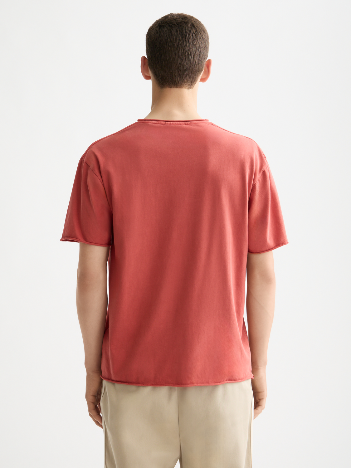 Raw edge SCOTCH & SODA short sleeve t-shirt with a casual fit, shown in black with distressed sleeve edges.