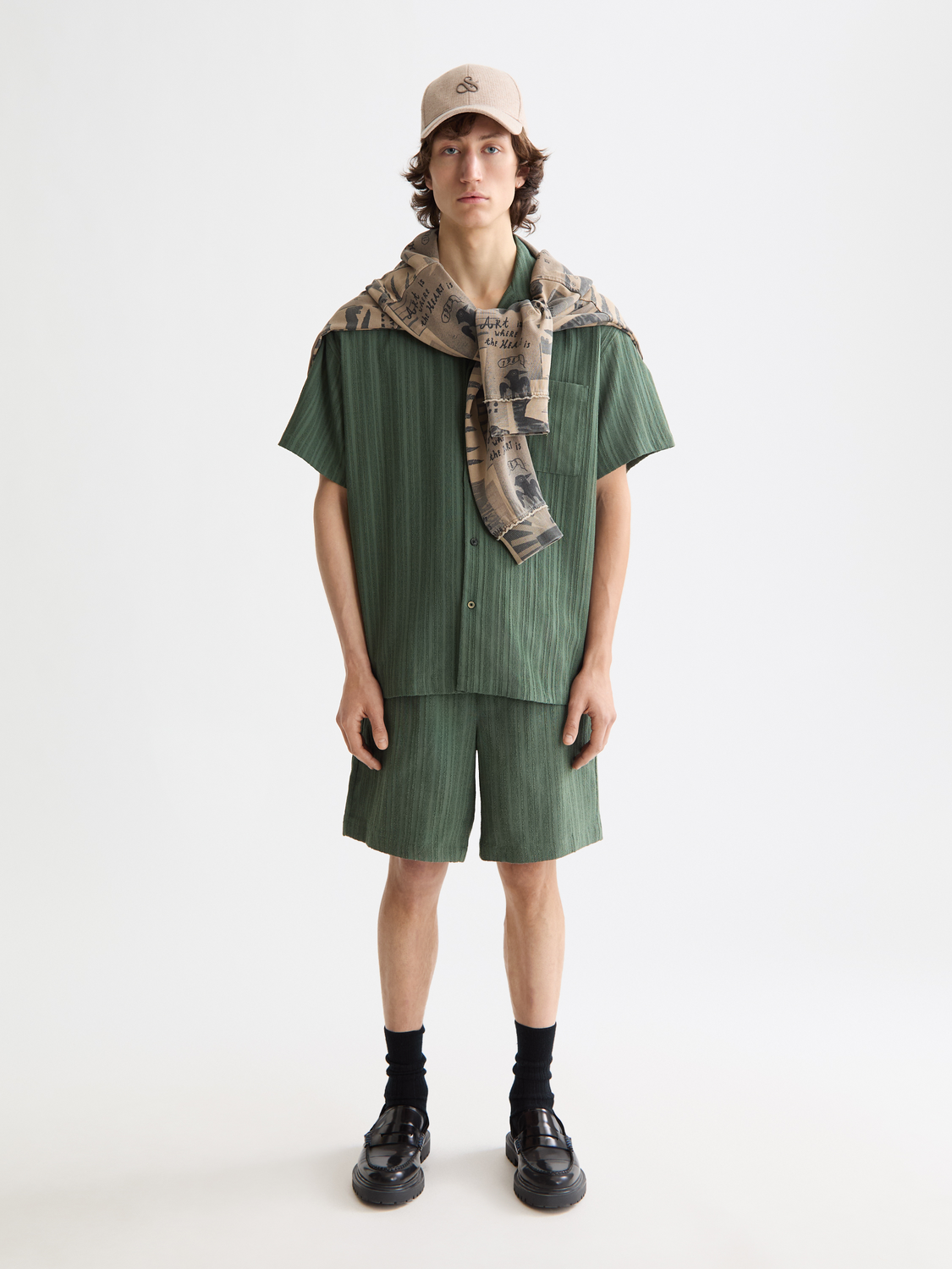 Striped shorts by Scotch & Soda with a relaxed fit, featuring bold horizontal stripes and a casual summer style.