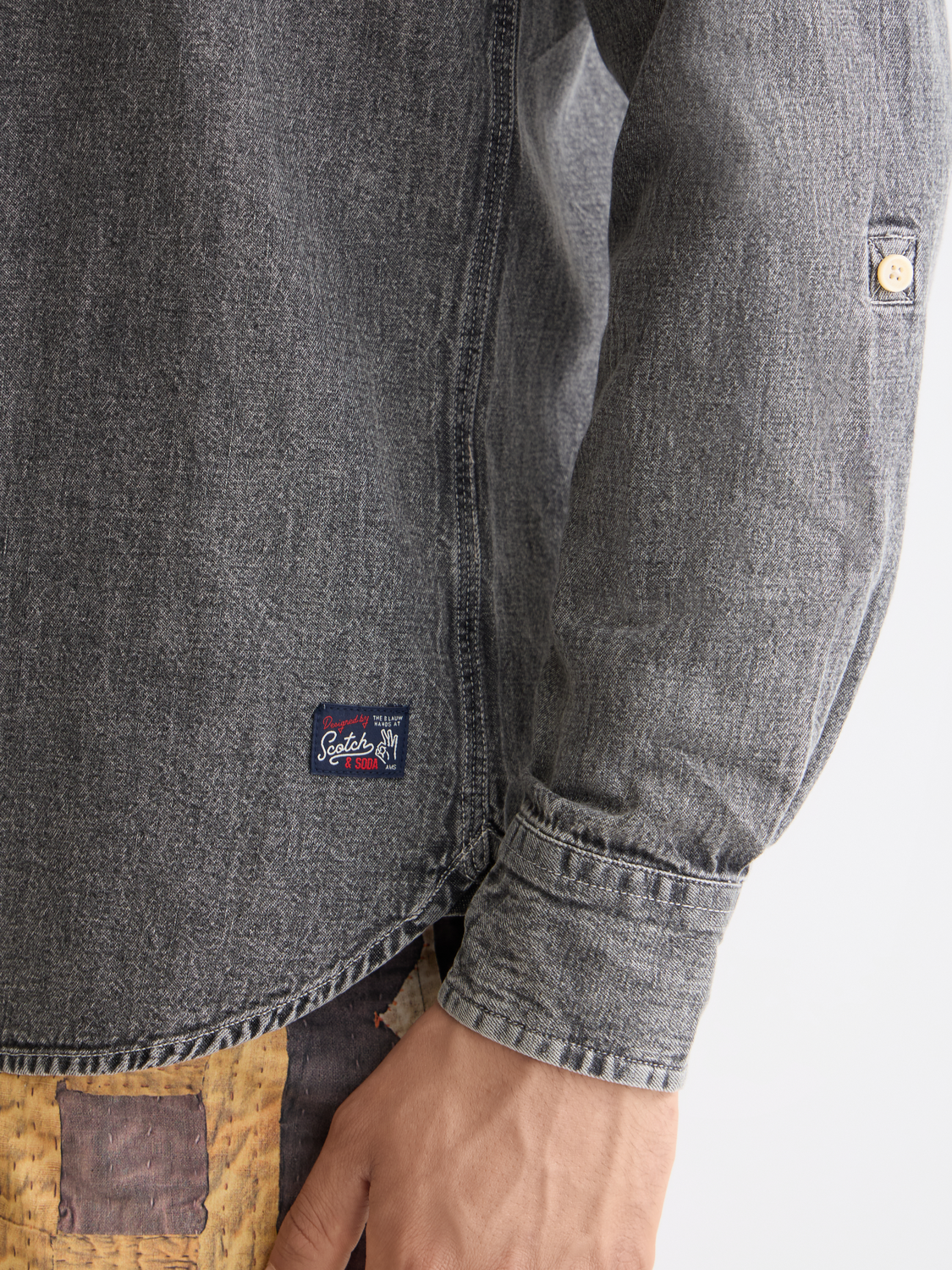 Long sleeve washed shirt by Scotch & Soda, showing soft fabric and casual fit in a detailed product image.