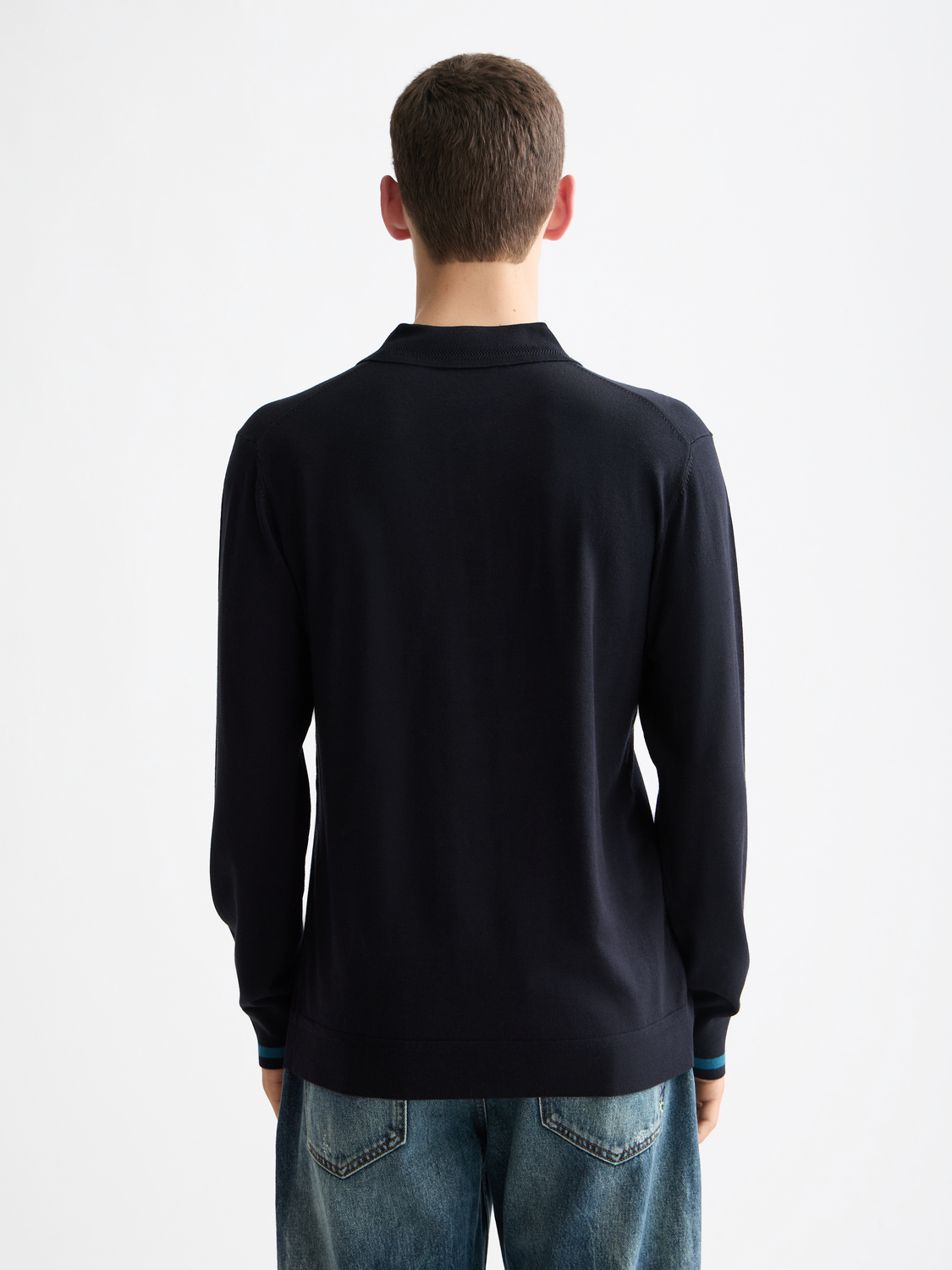 Blue knitted long-sleeved polo shirt by Scotch & Soda, featuring a classic collar and textured knit fabric.