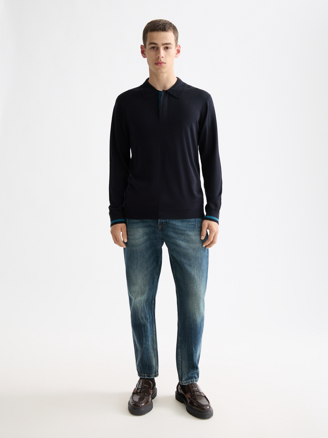 Knitted long-sleeved polo shirt from Scotch & Soda featuring a classic collar and ribbed cuffs in a neutral color.