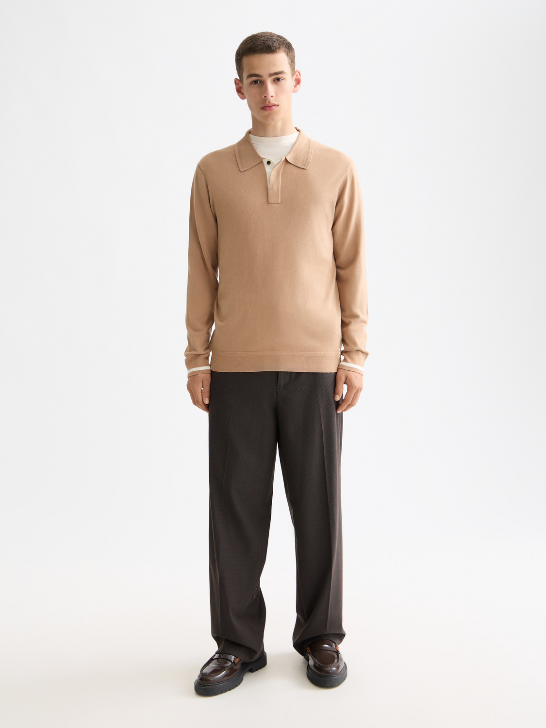 Scotch & Soda knitted long-sleeved polo shirt in navy with ribbed collar and cuffs, displayed on a white background.