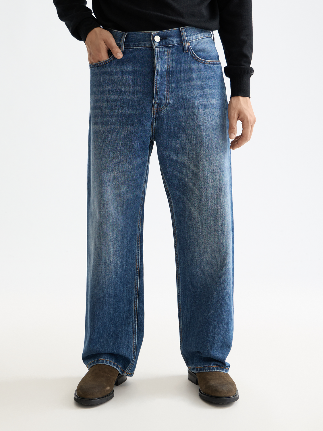 Scotch & Soda loose-fit denim jeans with classic five-pocket design and distressed details, front view showing relaxed fit.