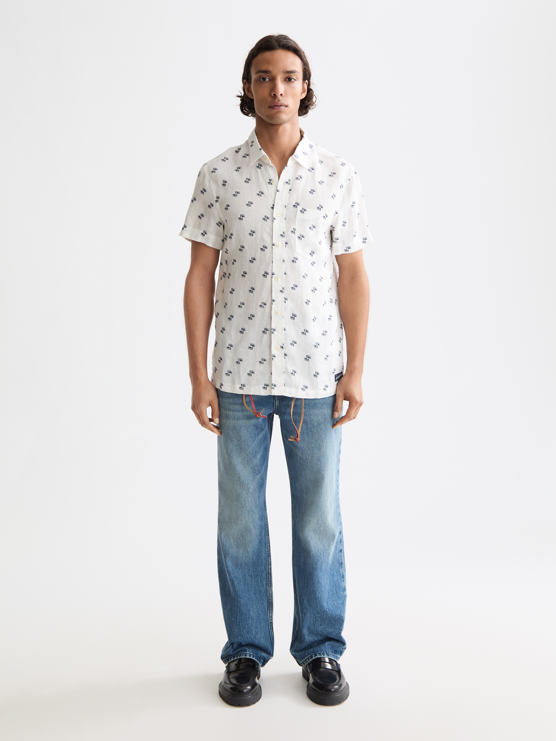 Printed Scotch & Soda short-sleeve shirt with colorful floral pattern on lightweight fabric, front view.