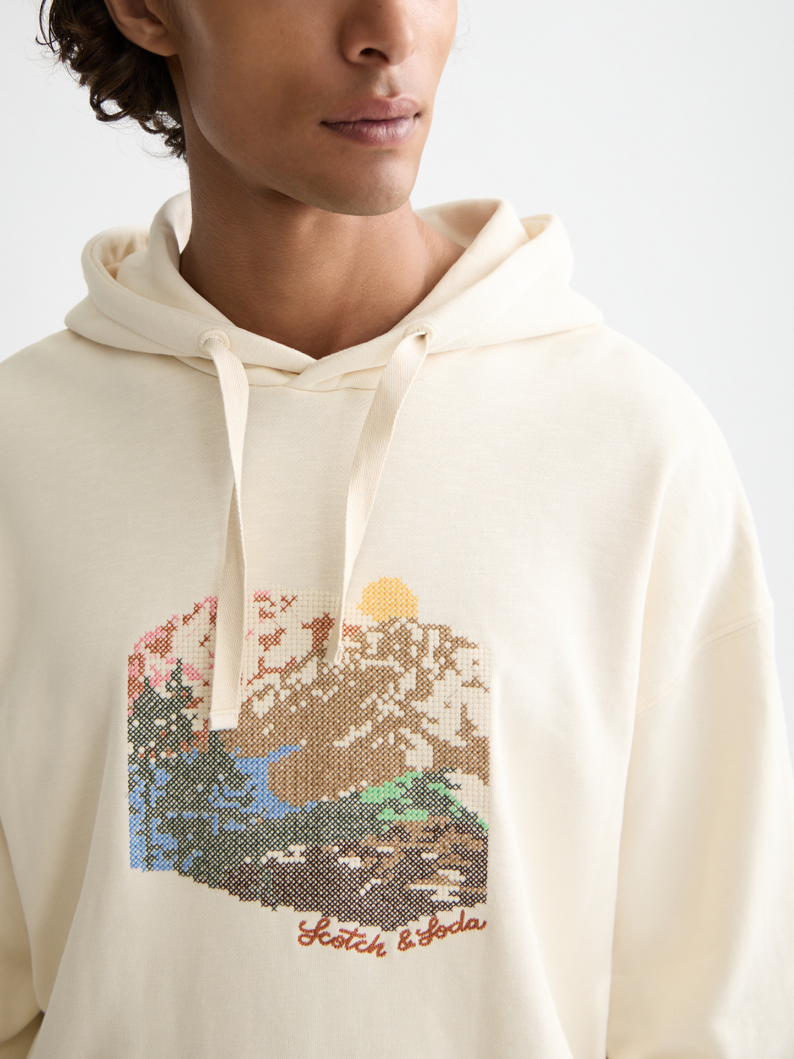 SCOTCH & SODA artwork hoodie, navy sweat with colorful graphic design, front view showing casual fit and detailed print.