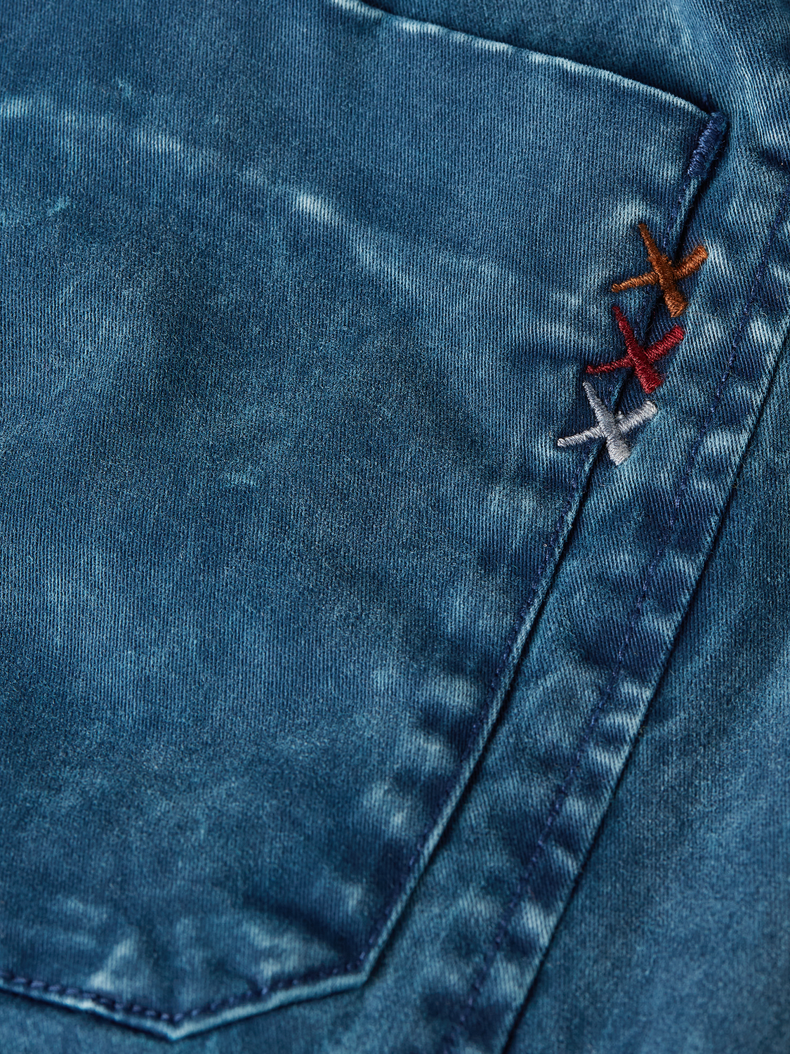 Kids' garment-dyed pants by Scotch & Soda, soft fabric with a comfortable fit, shown in a casual style.
