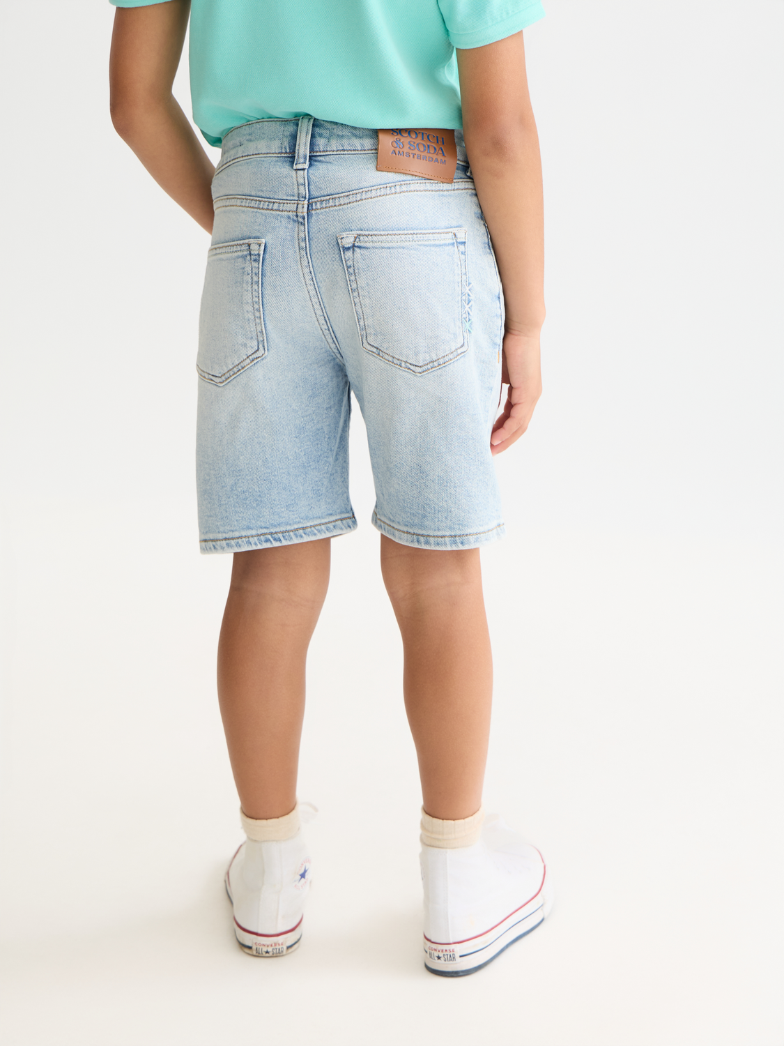 Kids' denim shorts by Scotch & Soda, loose-fit pitch shorts with back view, casual and comfortable for children.