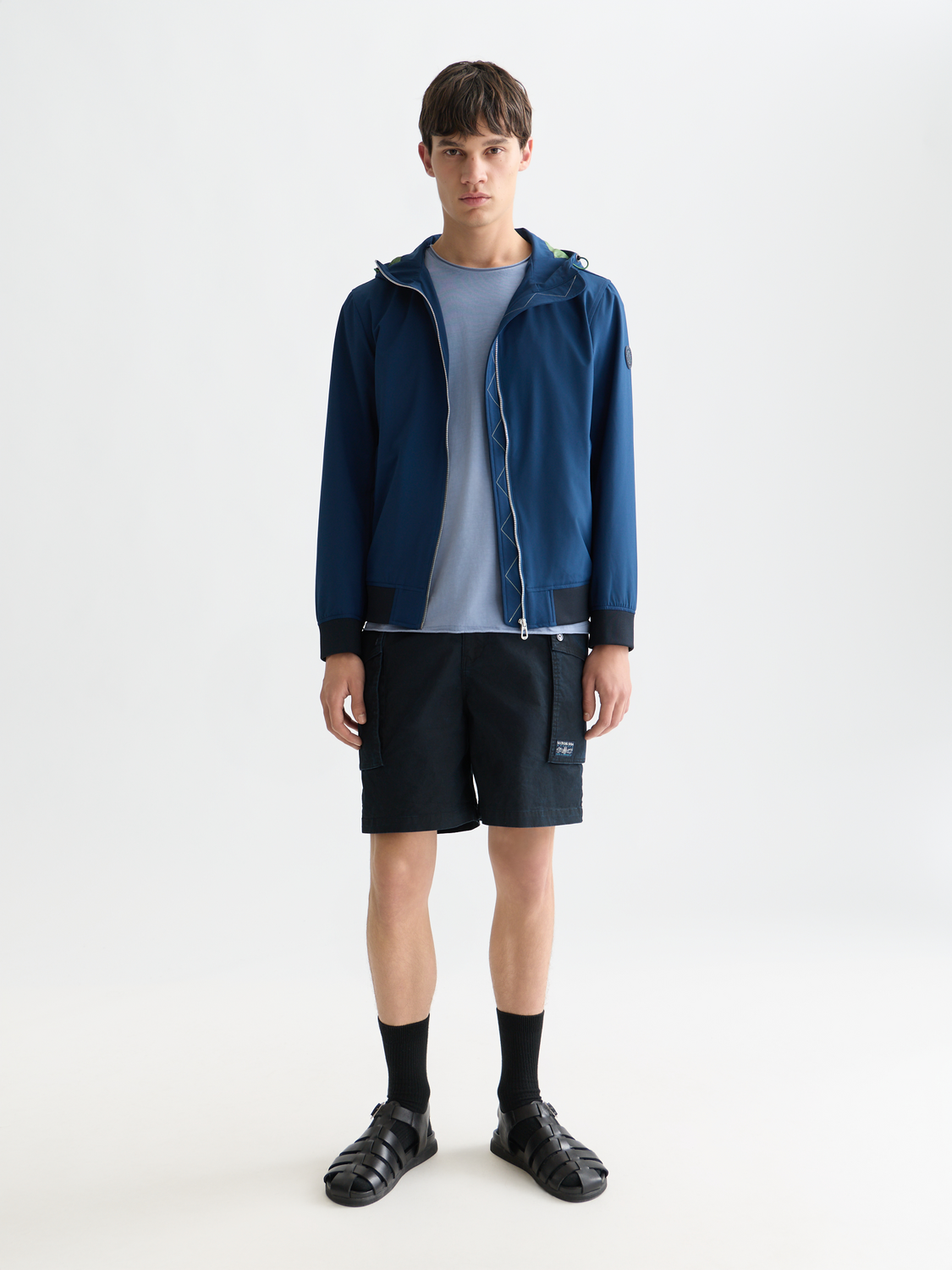Scarlet hooded softshell jacket by Scotch & Soda, showing front view with adjustable hood and zip closure.