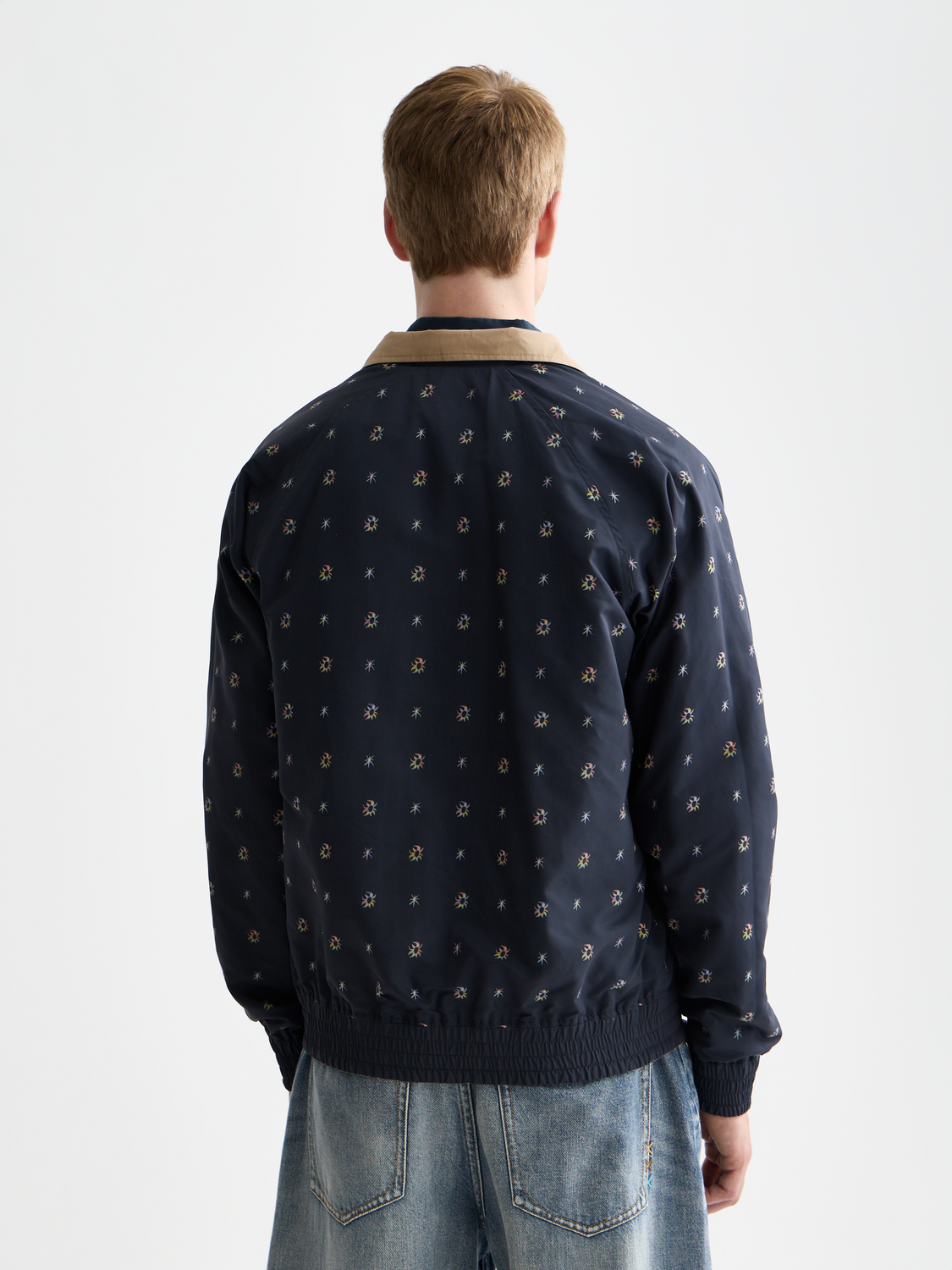 Reversible jacket by Scotch & Soda featuring a stylish design, shown with both sides visible, suitable for versatile fashion.
