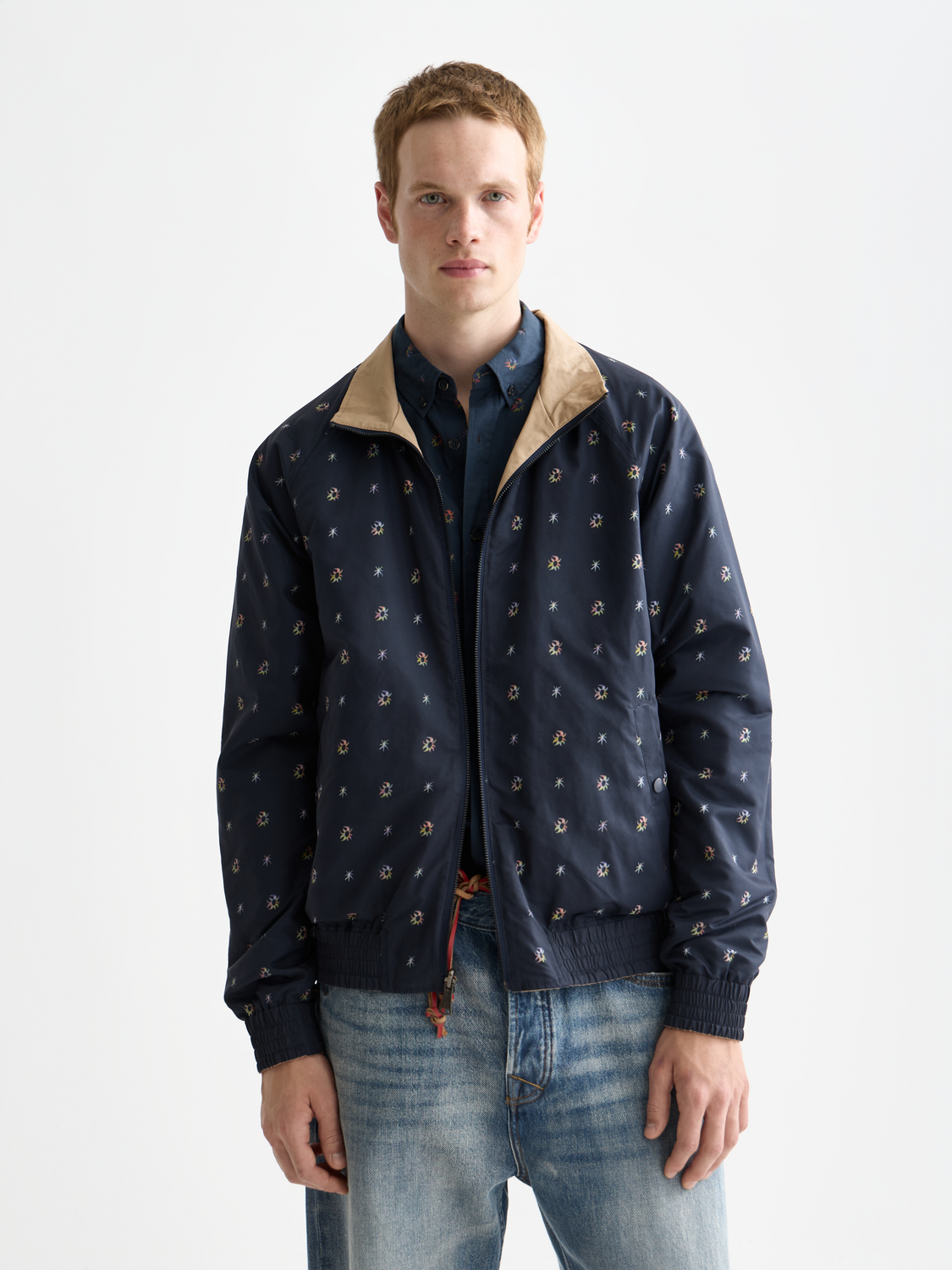 Reversible Scotch & Soda jacket with one side in solid color and the other patterned, displayed on a hanger.