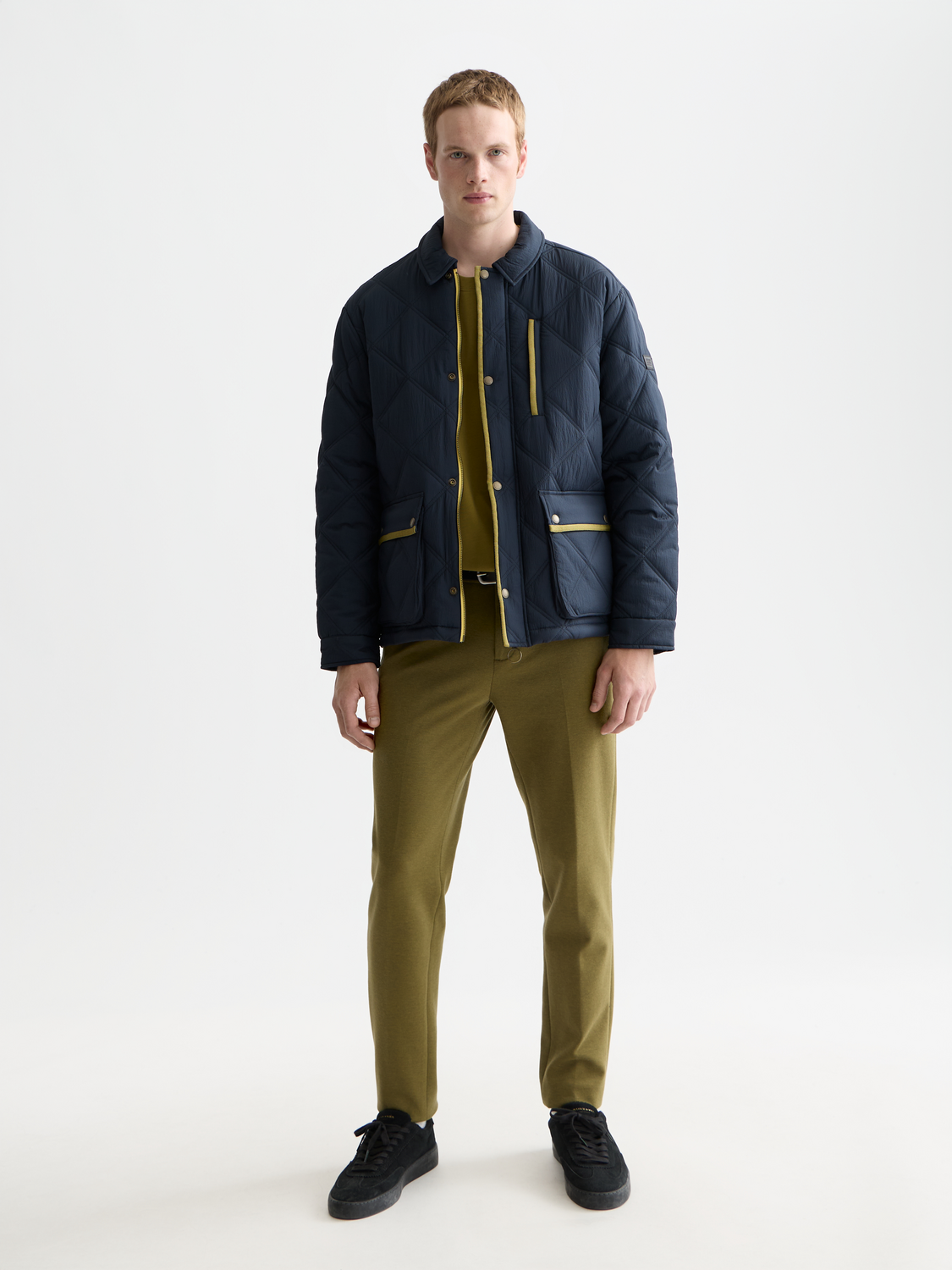 Scotch & Soda quilted jacket in navy with front zipper and stand collar, lightweight and stylish for casual wear.