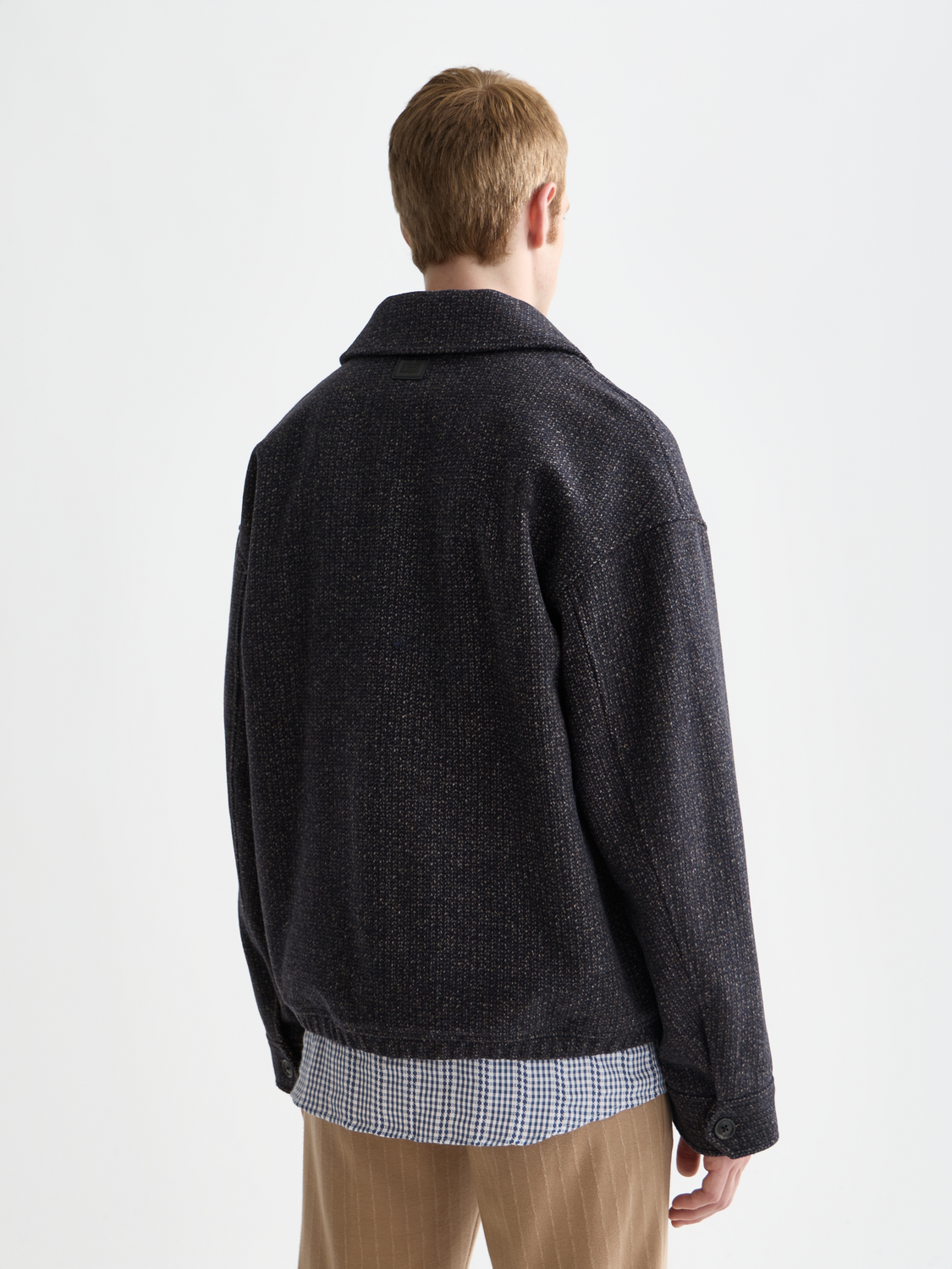 Textured SCOTCH & SODA jacket with a close-up view of the back, showcasing the fabric's detailed pattern and design.