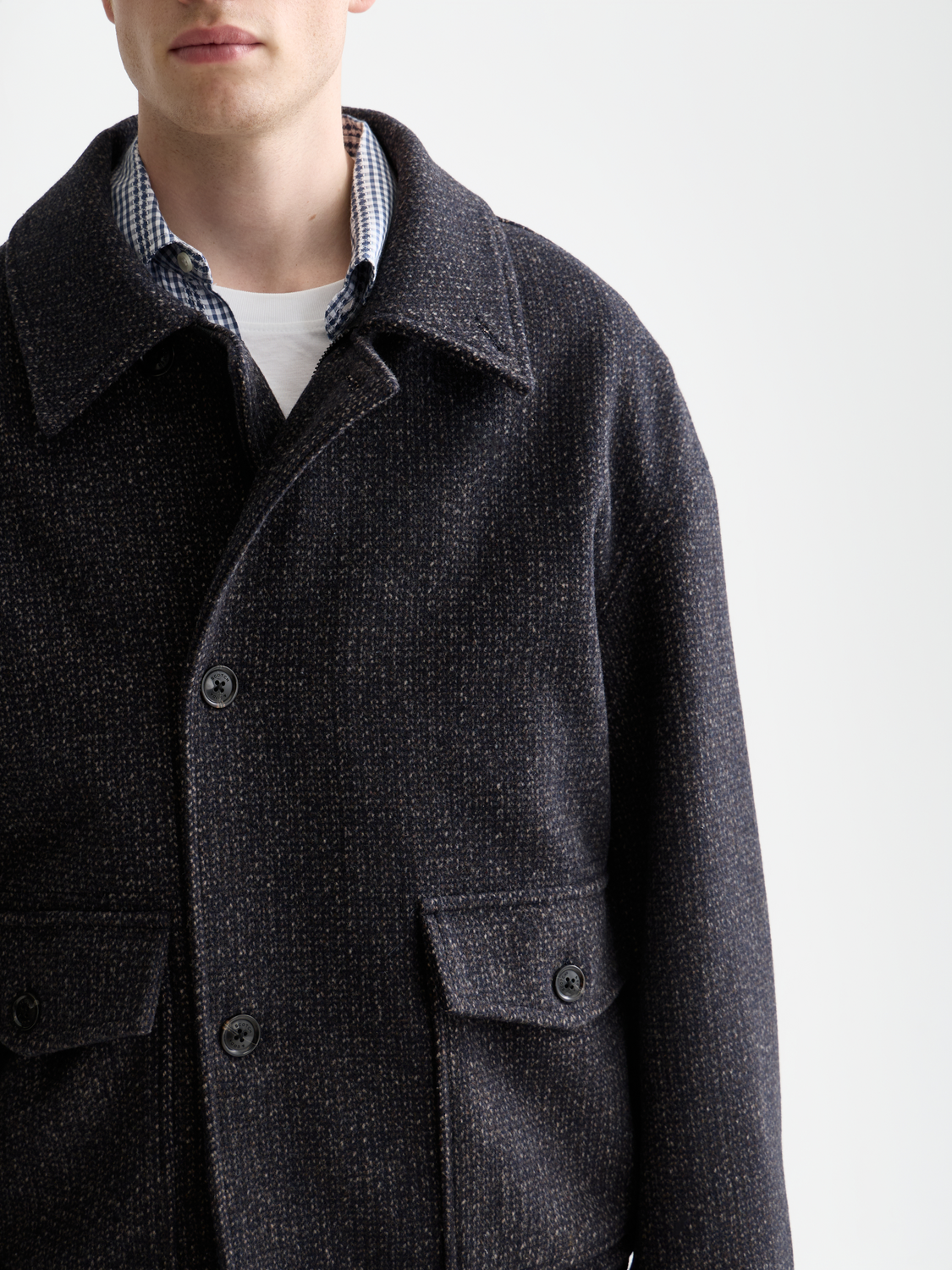 Textured SCOTCH & SODA jacket with a stylish design, shown on a hanger against a neutral background.