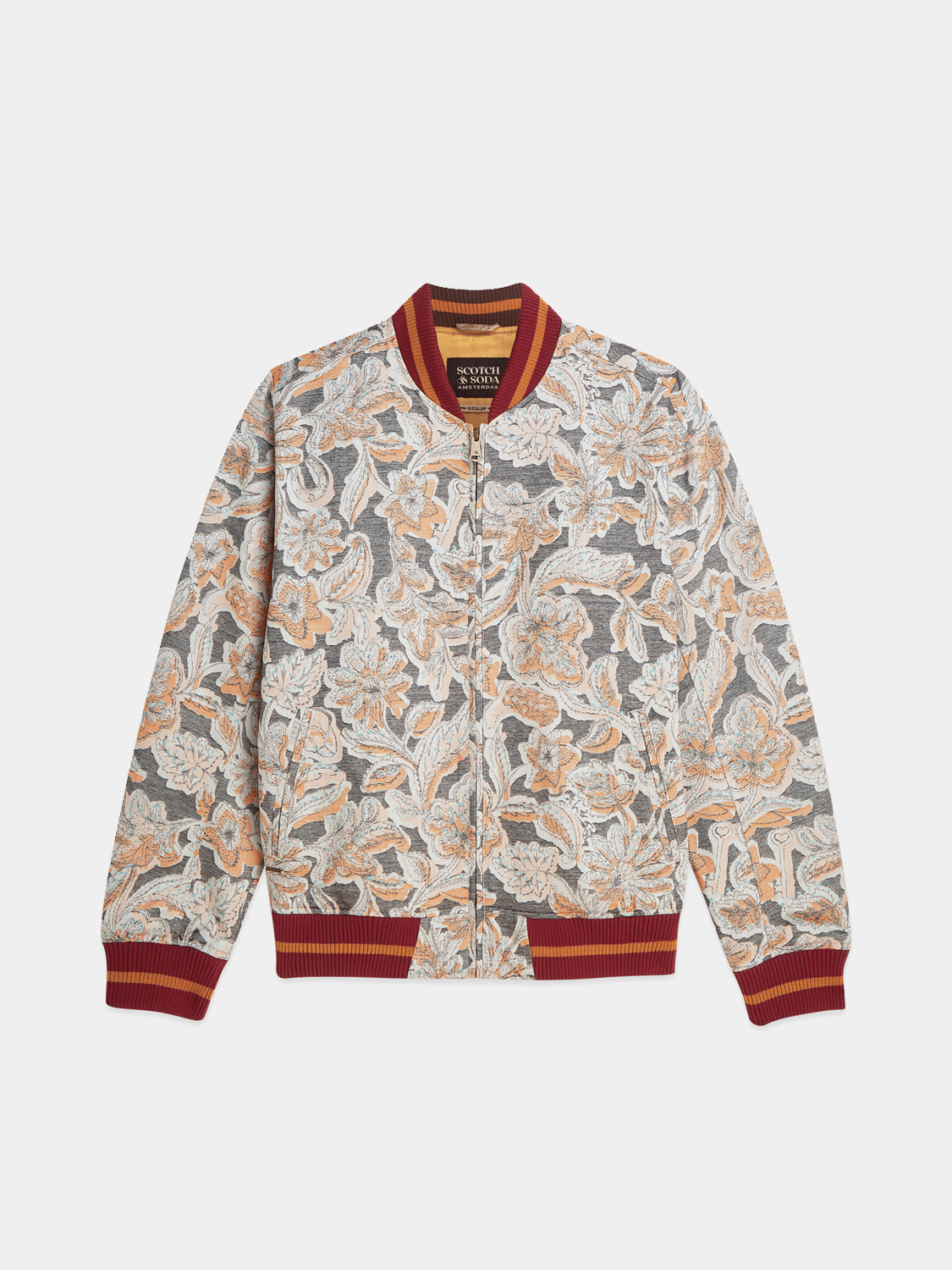 SCOTCH & SODA jacquard souvenir jacket with intricate pattern, standing collar, and button closure, showcasing detailed craftsmanship.