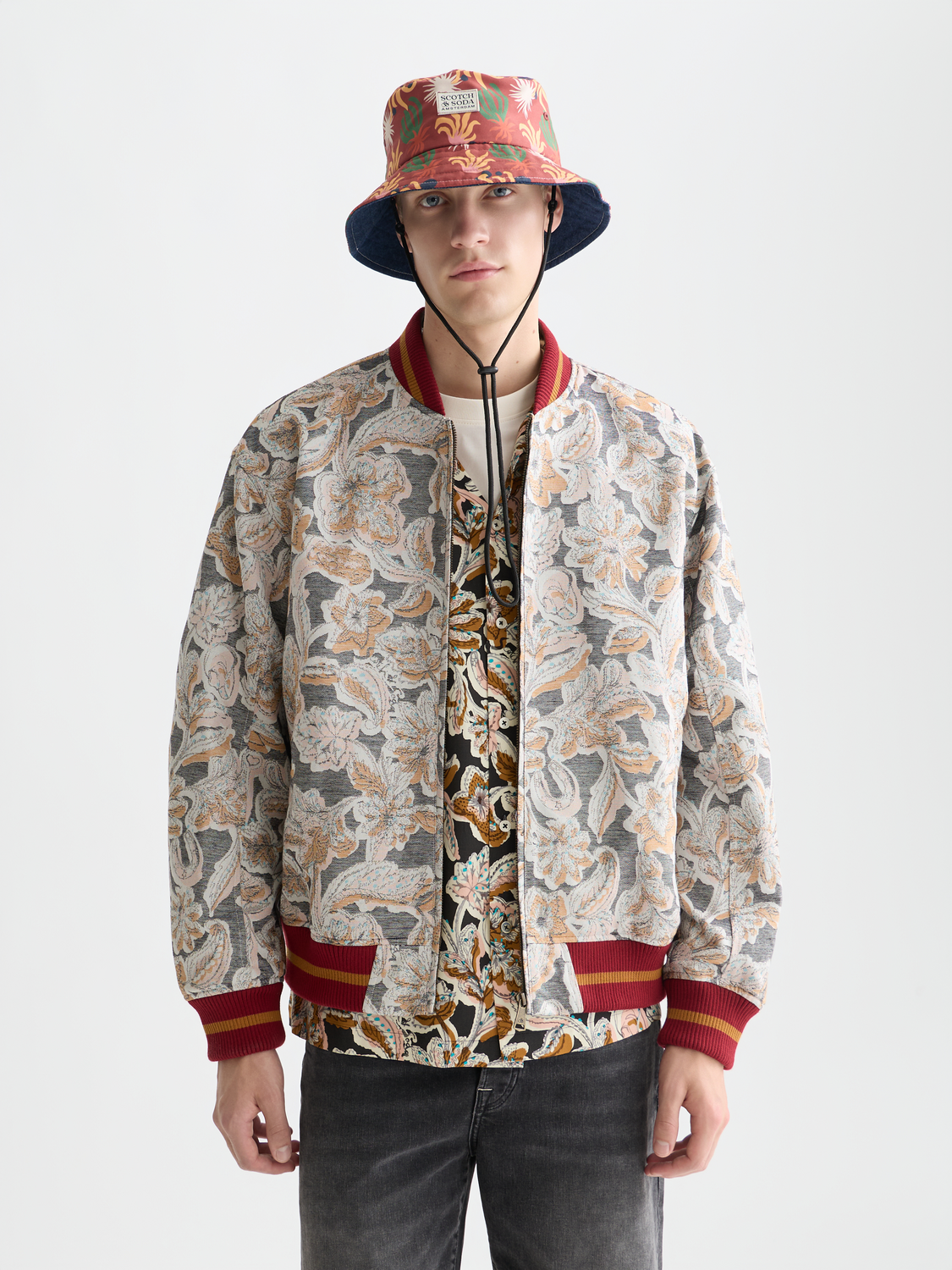 Scotch & Soda jacquard souvenir jacket featuring intricate woven patterns and a classic collar, front view image.