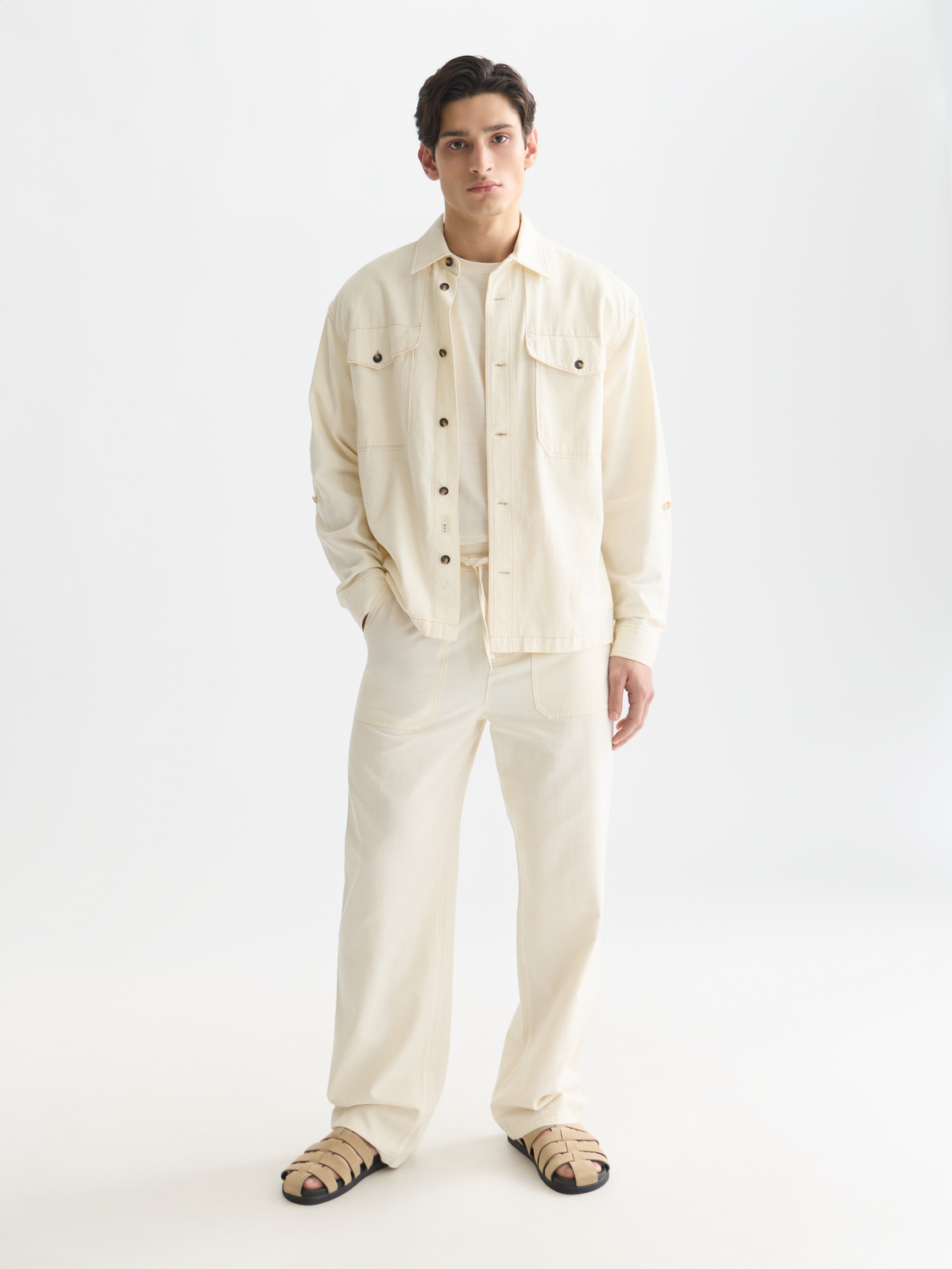Light beige cotton-linen overshirt jacket by Scotch & Soda, showing front view with collar and button details.