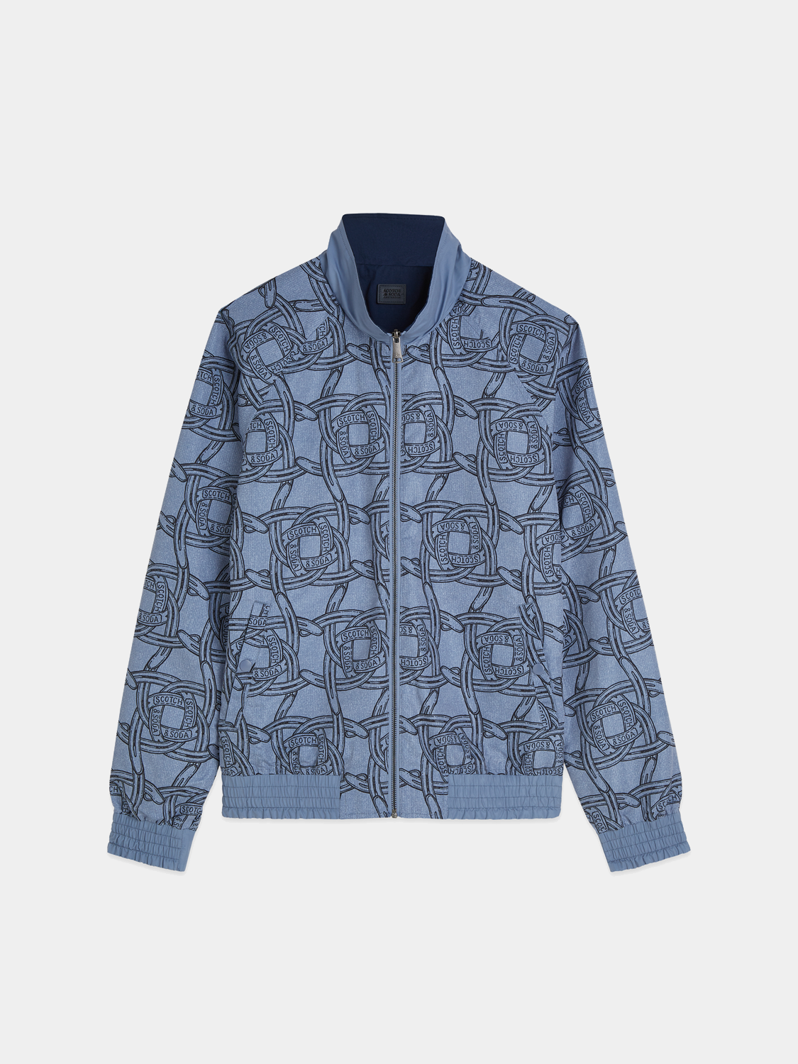 Reversible printed jacket by Scotch & Soda showing colorful design on one side and solid color on the other.