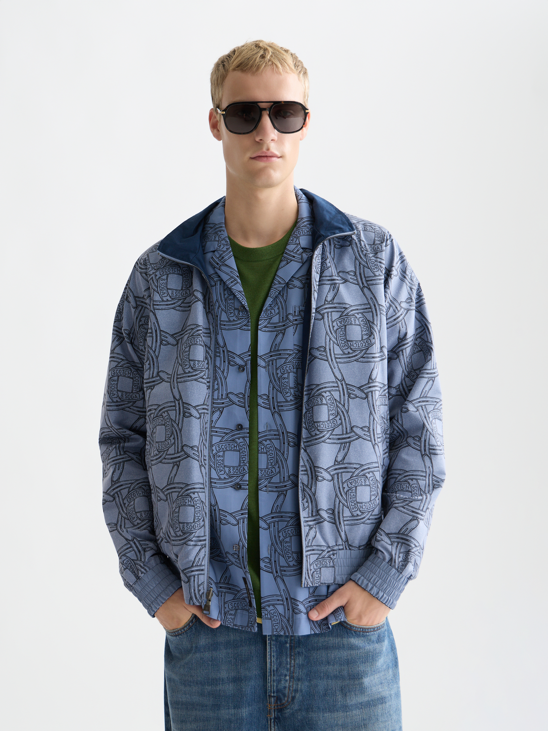 Reversible printed jacket by Scotch & Soda showing both patterned and solid sides, with a casual fit and vibrant design.
