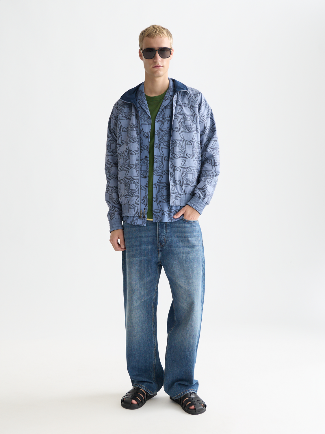 Reversible printed jacket from Scotch & Soda showing colorful patterns on both sides, displayed on a model.