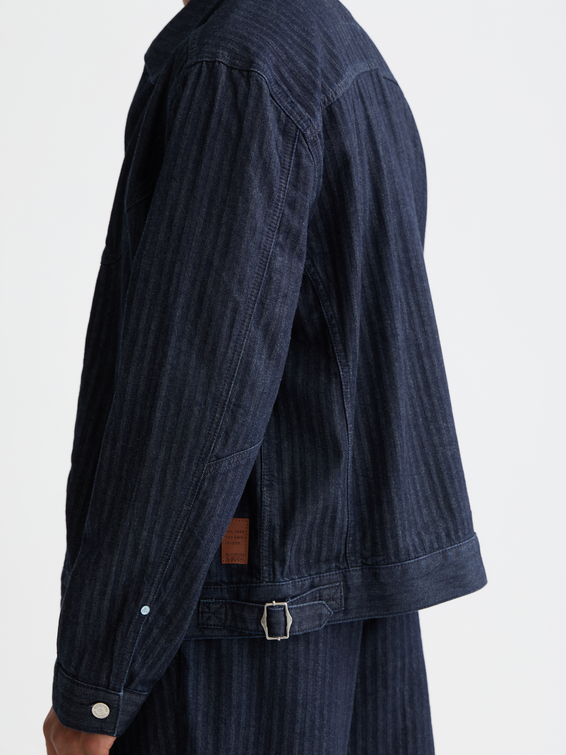 SCOTCH & SODA trucker jacket shown in classic denim style with front pockets and button closure.