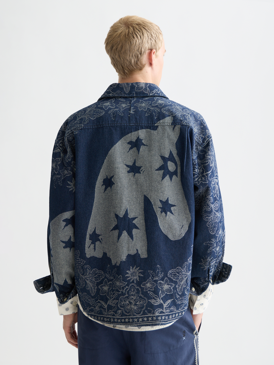 Blue denim jacquard overshirt jacket by Scotch & Soda, featuring intricate woven patterns and a button-up front.