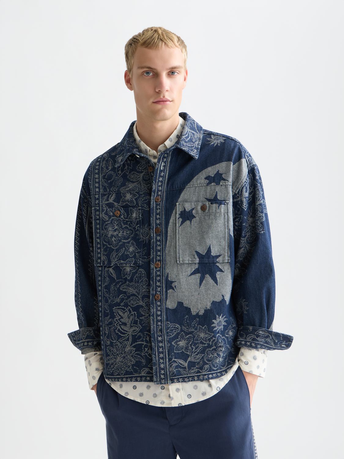 Denim jacquard overshirt by Scotch & Soda, showing detailed pattern and button-front design in a close-up image.