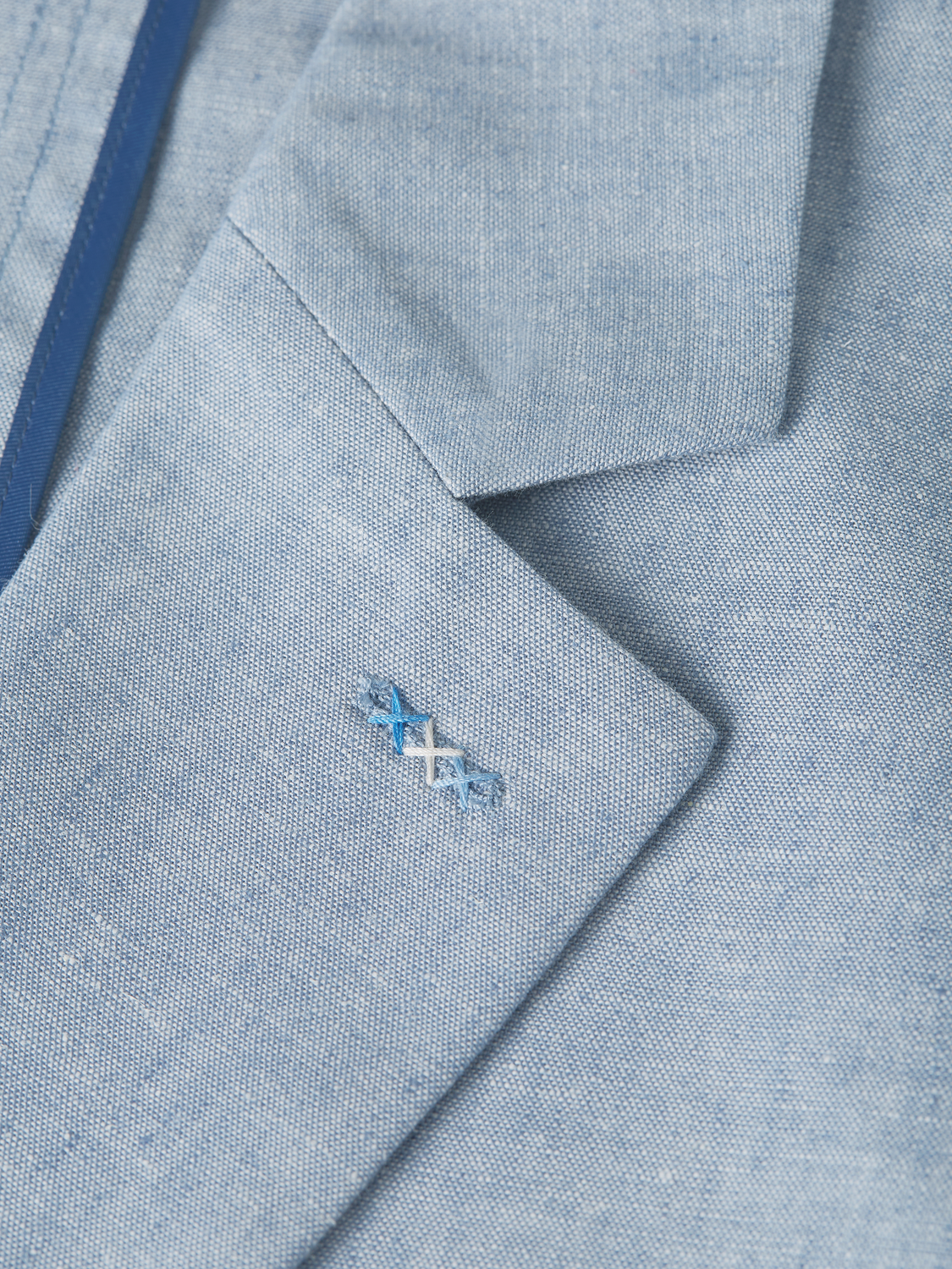 Unconstructed blazer by Scotch & Soda, tailored fit with classic lapel and pocket details, in neutral fabric.