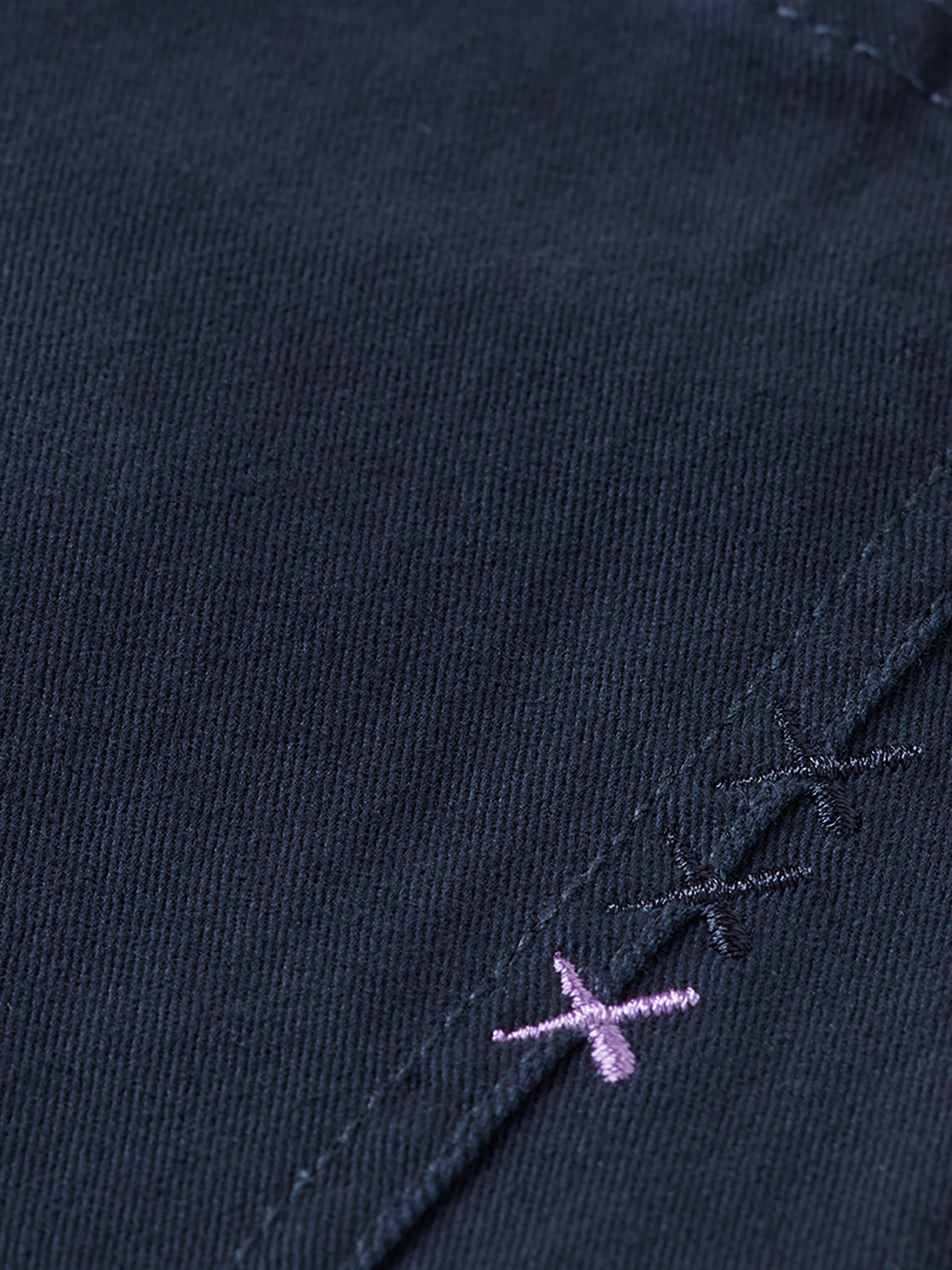 Slim-fit Ralston pants by Scotch & Soda in a dark denim fabric, shown on a model with front and back views.