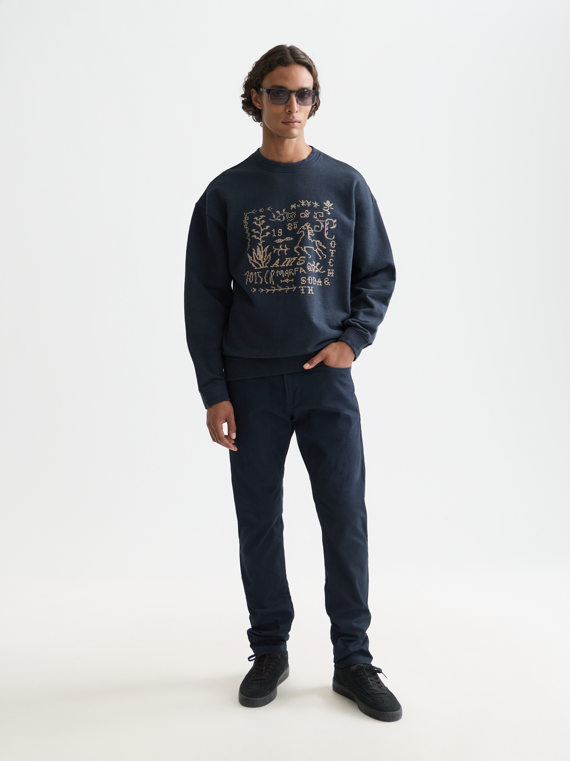 Slim-fit Ralston pants by Scotch & Soda, featuring a tailored design in a neutral color, shown on a model.