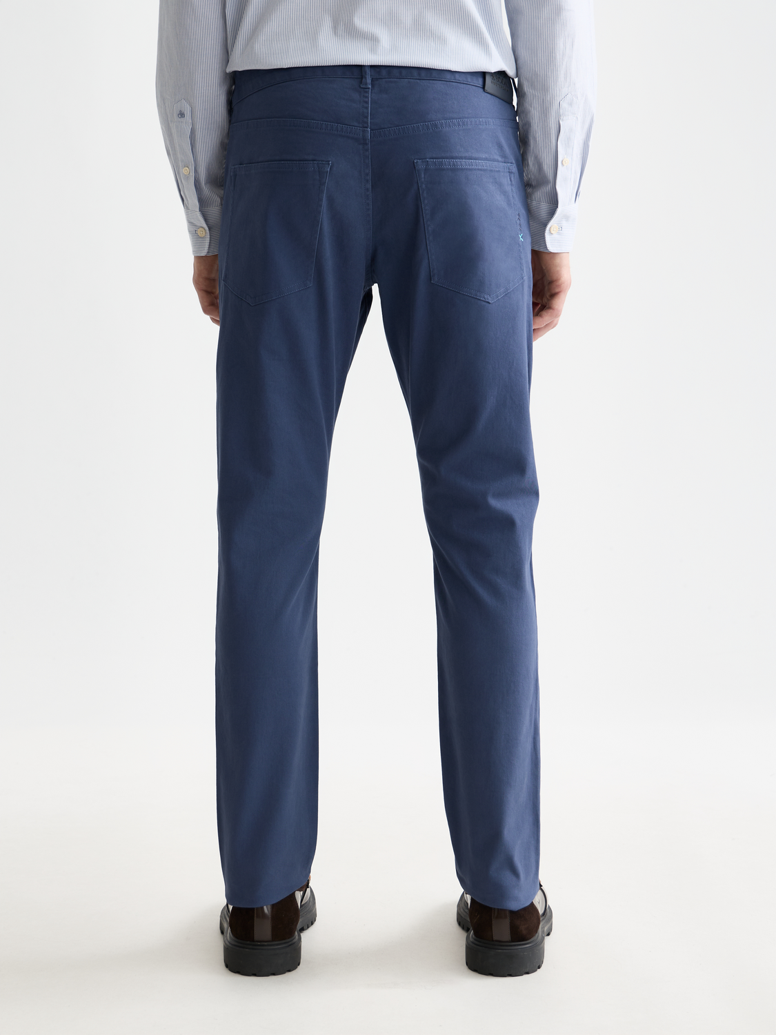 SCOTCH & SODA Ralston slim-fit pants in dark fabric, shown from the back with a tailored fit and minimalist design.