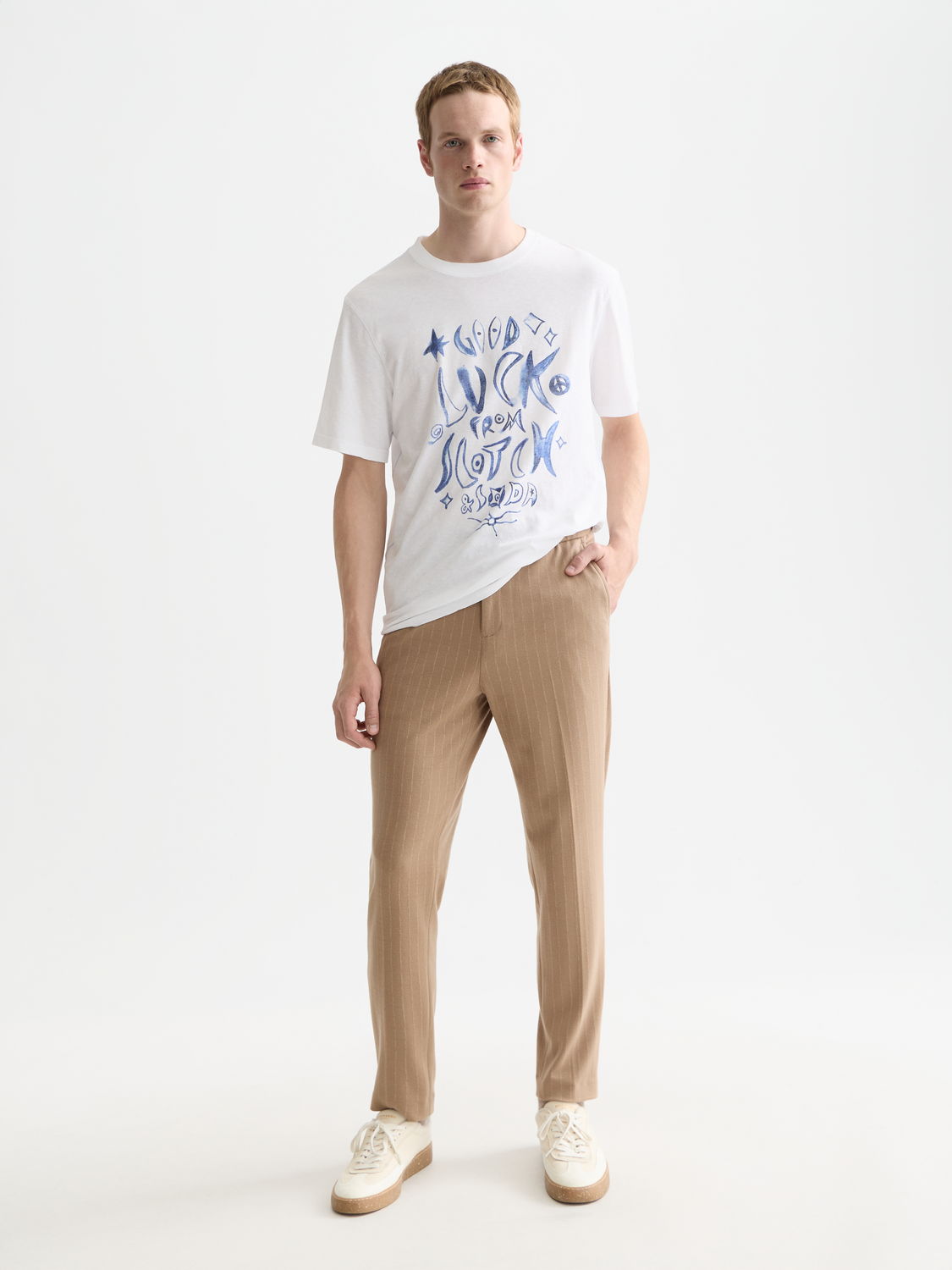 Scotch & Soda Finch tapered-fit pants in dark fabric, showing front view with pockets and tailored design.
