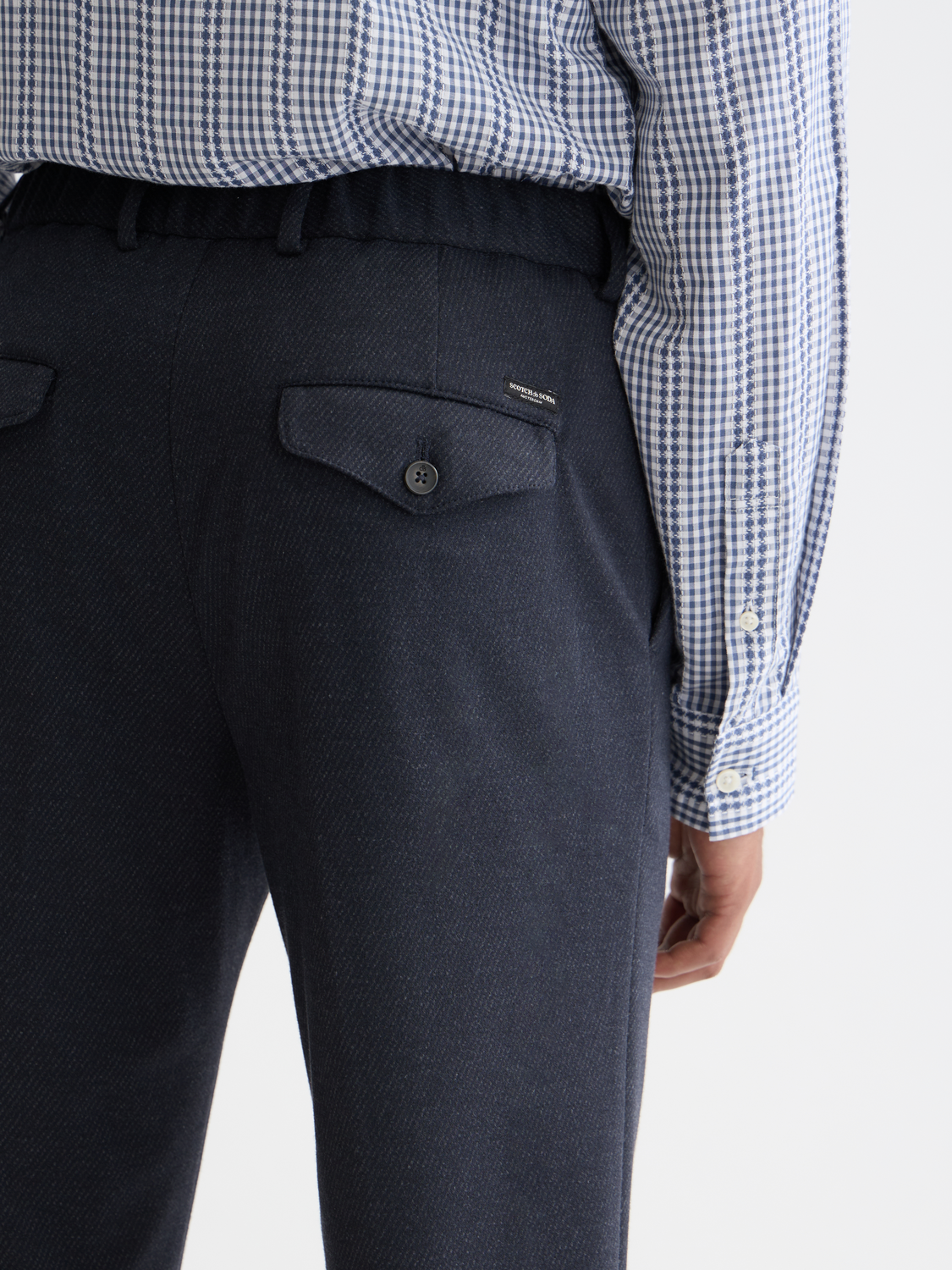SCOTCH & SODA Finch tapered-fit pants in dark fabric, showing the front view with a sleek, modern design and tailored fit.