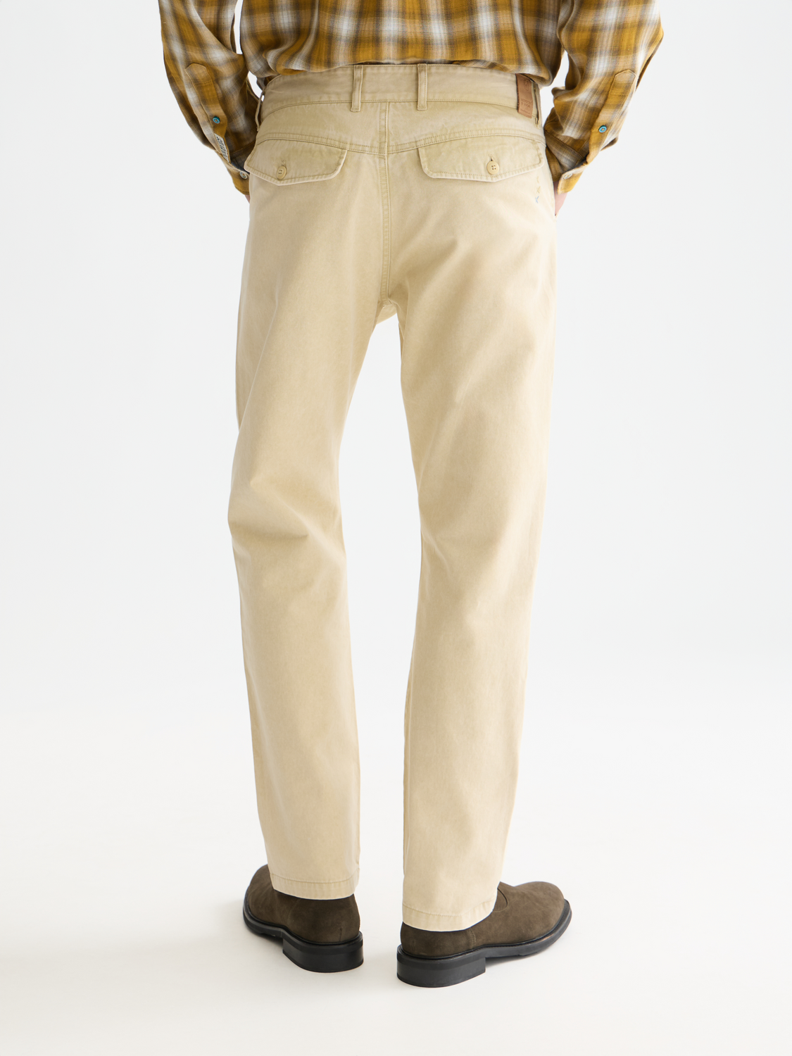SCOTCH & SODA Zee straight-fit pants in dark fabric, showing the back view with tailored waistband and neat stitching.