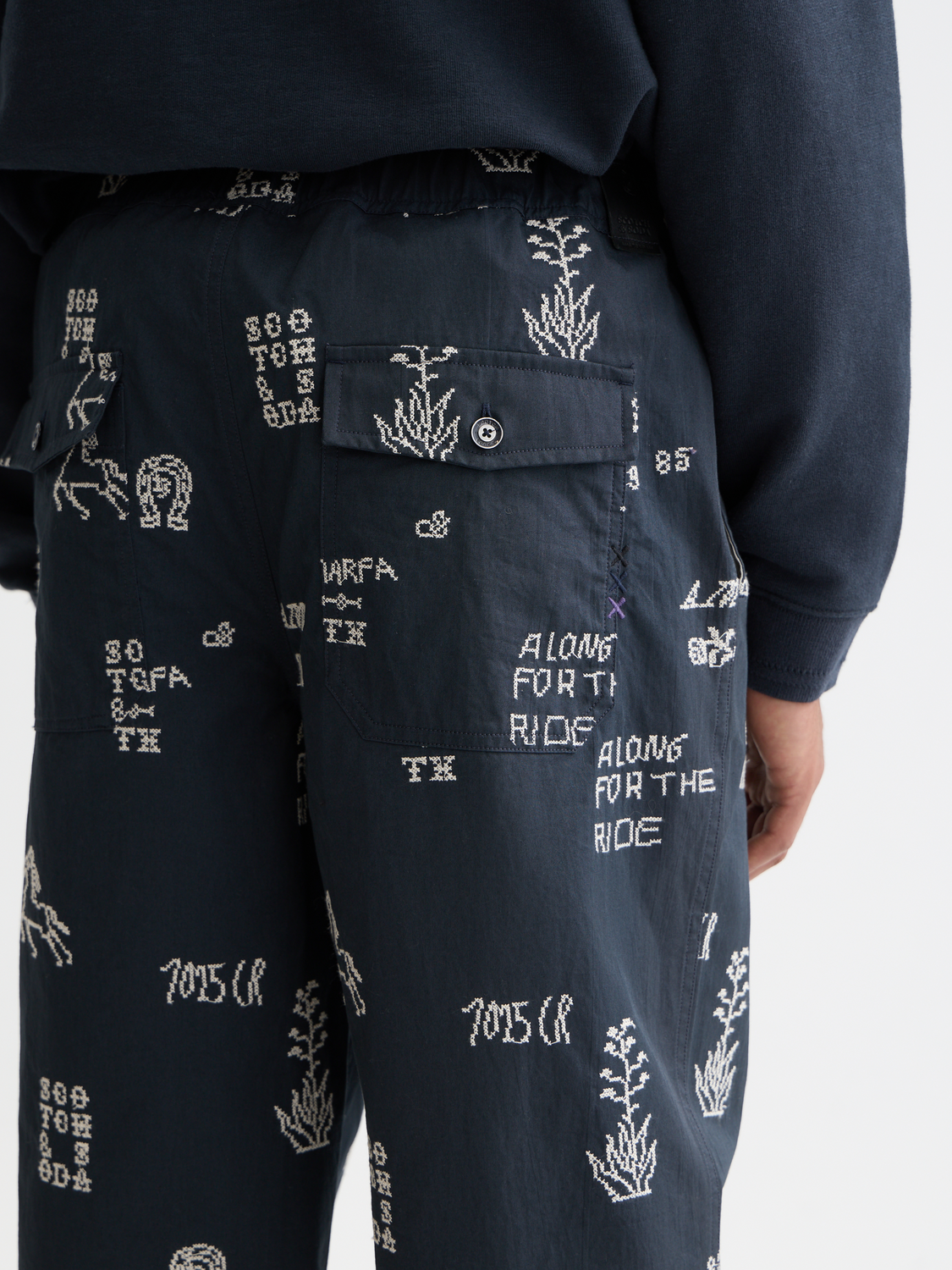 Embroidered Scotch & Soda chinos pants with detailed stitching, slim fit, and classic design for casual or smart-casual wear.