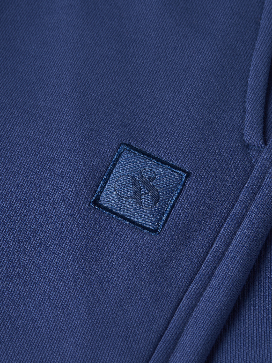 SCOTCH & SODA logo badge sweatshorts featuring a casual fit, elastic waistband, and branded logo detail on the front.