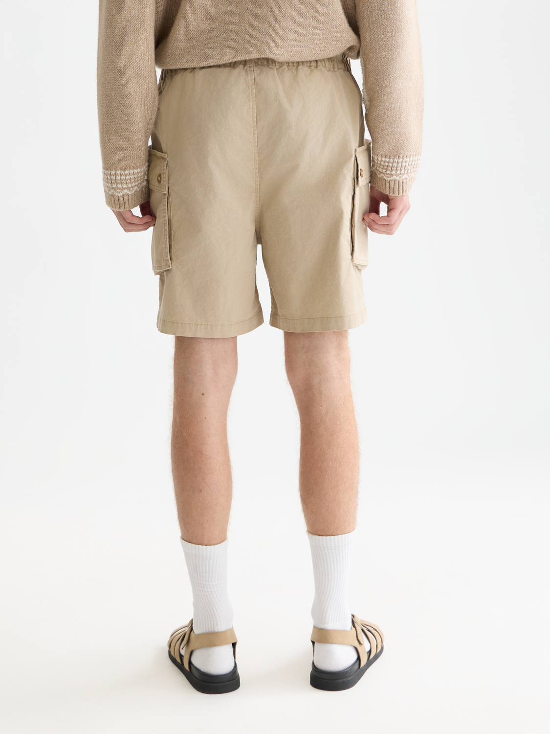 SCOTCH & SODA cargo shorts featuring multiple pockets, casual fit, and denim fabric, shown from the back.