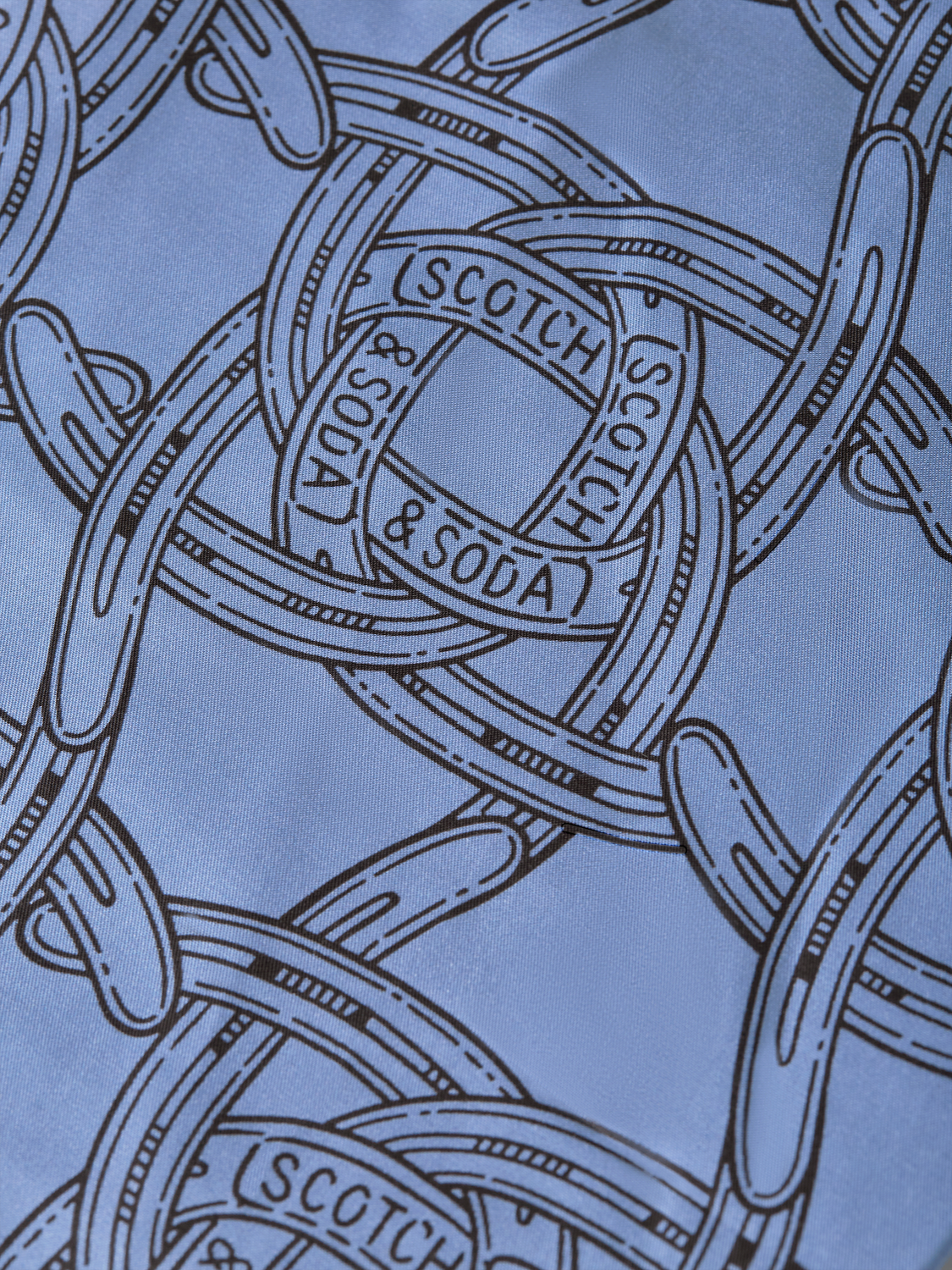 Fave printed shorts by Scotch & Soda featuring vibrant patterns and casual fit, shown in a close-up view.