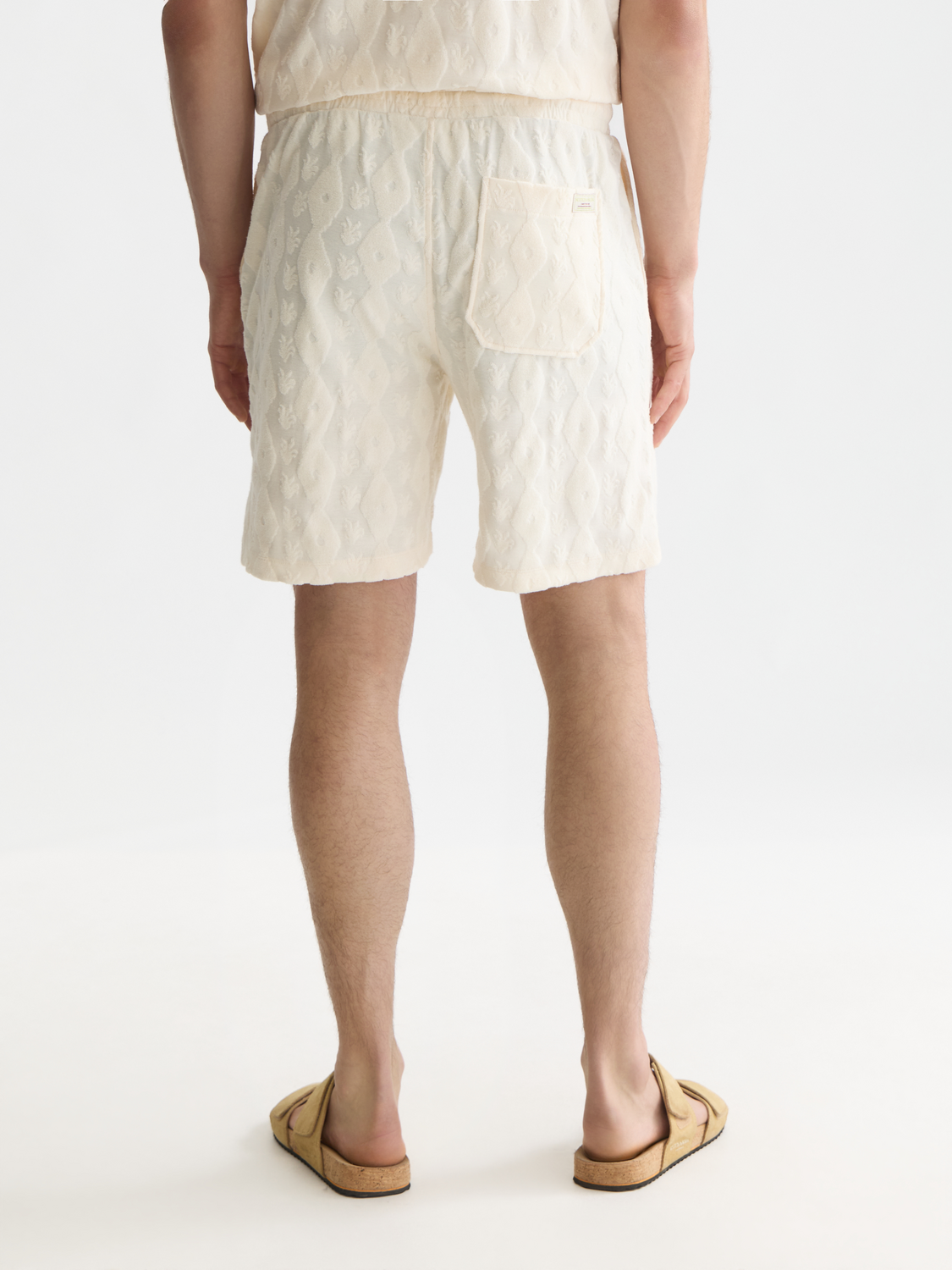Light blue Scotch & Soda Fave terry shorts with a relaxed fit and back pocket, displayed on a model.