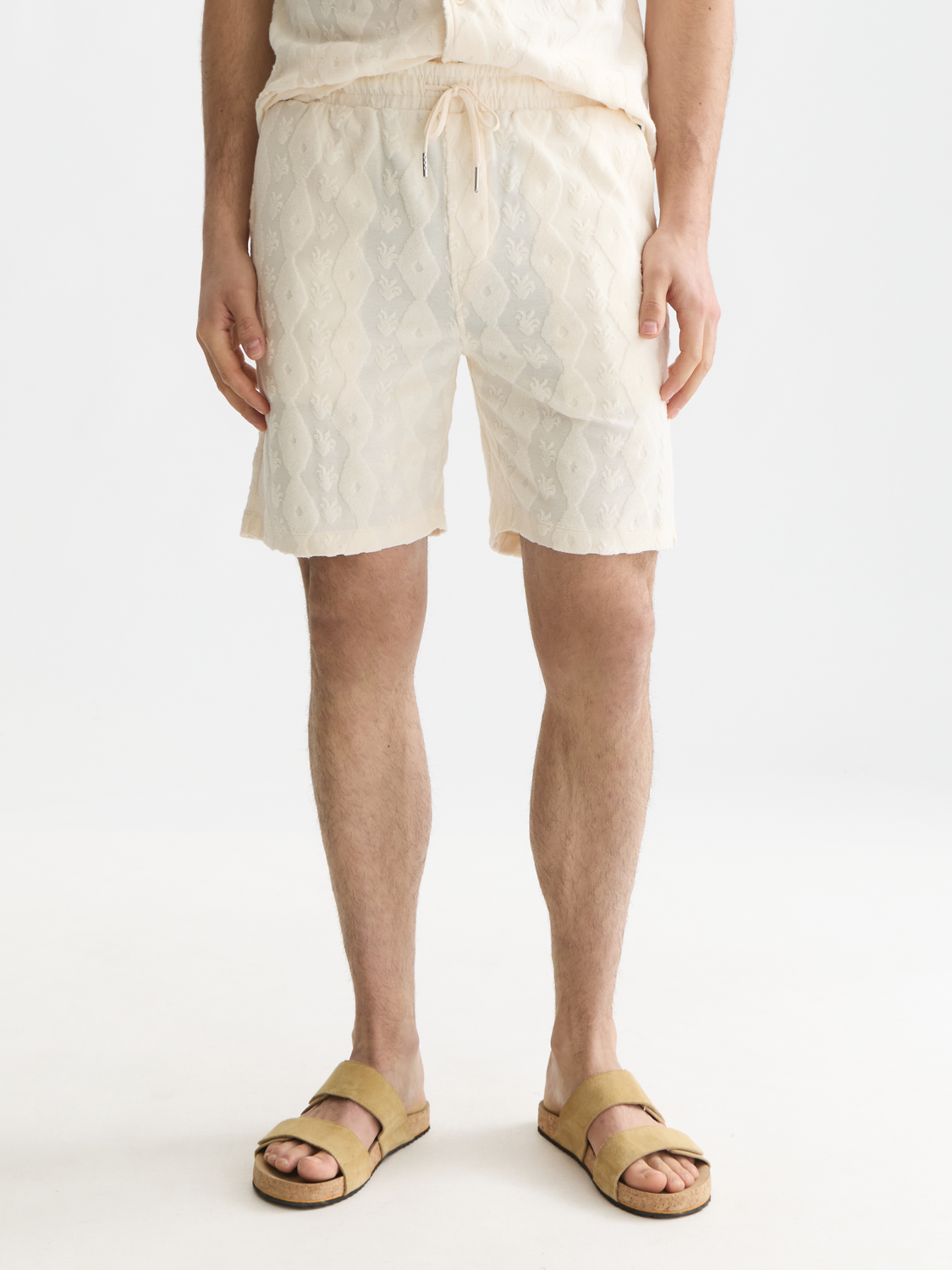 SCOTCH & SODA Fave terry shorts in light blue, featuring a relaxed fit and drawstring waistband, front view.