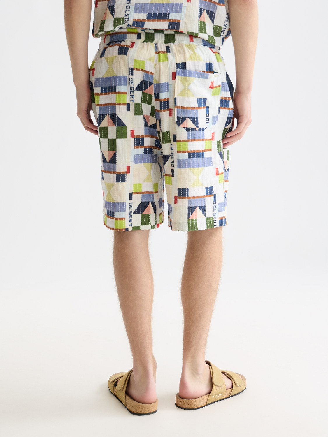 Printed stitched shorts by Scotch & Soda featuring a colorful pattern and front stitching, shown from the back view.
