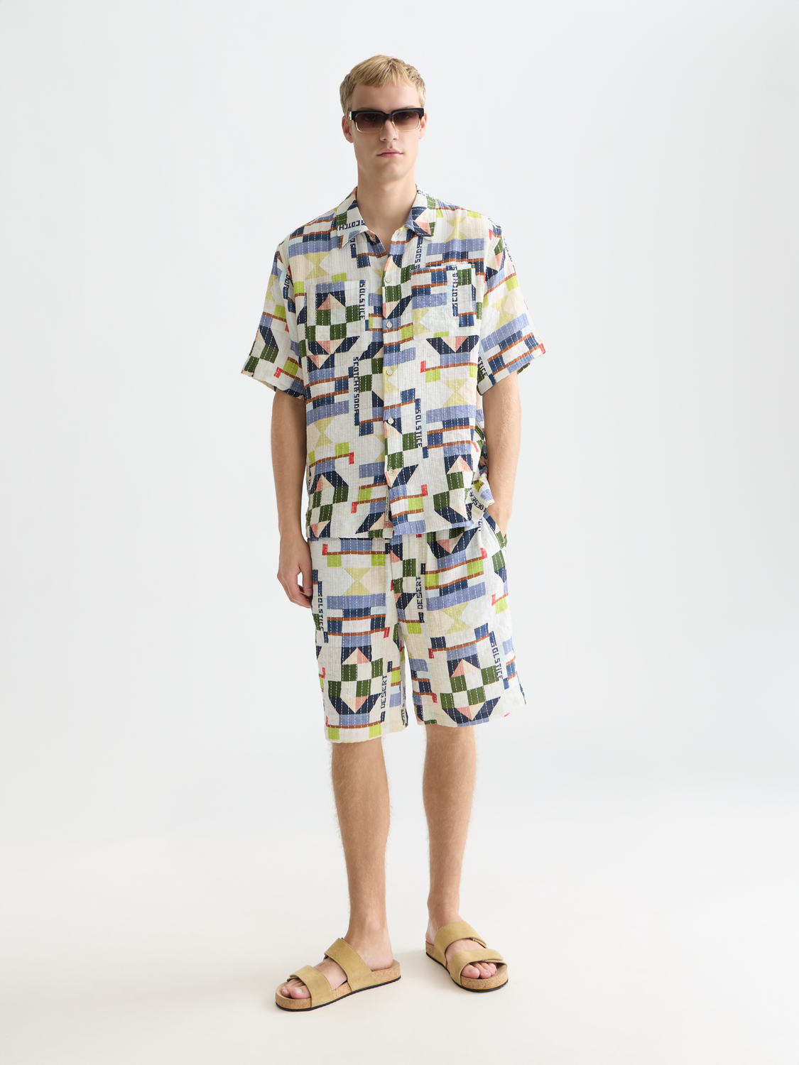 Printed stitched shorts from Scotch & Soda featuring colorful fabric and a relaxed fit, ideal for casual summer wear.