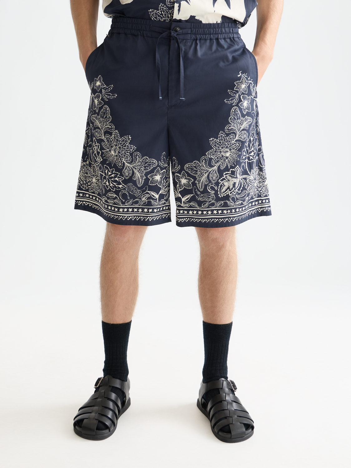 Printed Scotch & Soda shorts featuring a colorful floral pattern, lightweight fabric, and casual fit for summer wear.