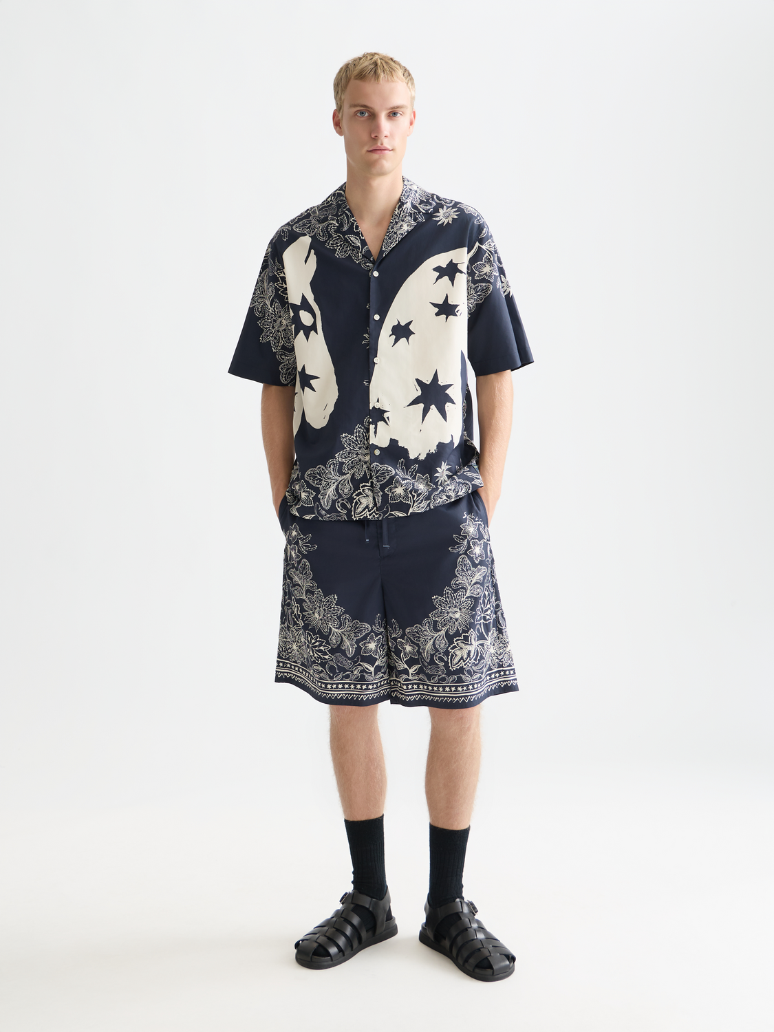 Printed shorts by Scotch & Soda, featuring colorful patterns and casual fit, displayed on a neutral background.