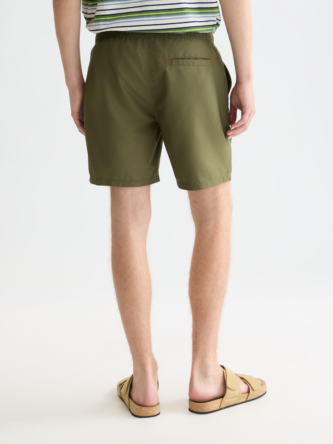 Mid-length Scotch & Soda swim shorts in dark coral color with a back pocket, displayed flat on a white background.