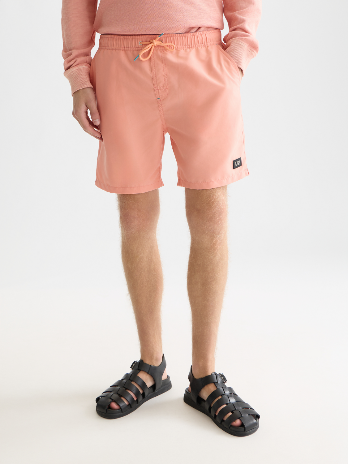 Mid-length SCOTCH & SODA swimshorts with a vibrant, patterned design, featuring a comfortable elastic waistband and side pockets.