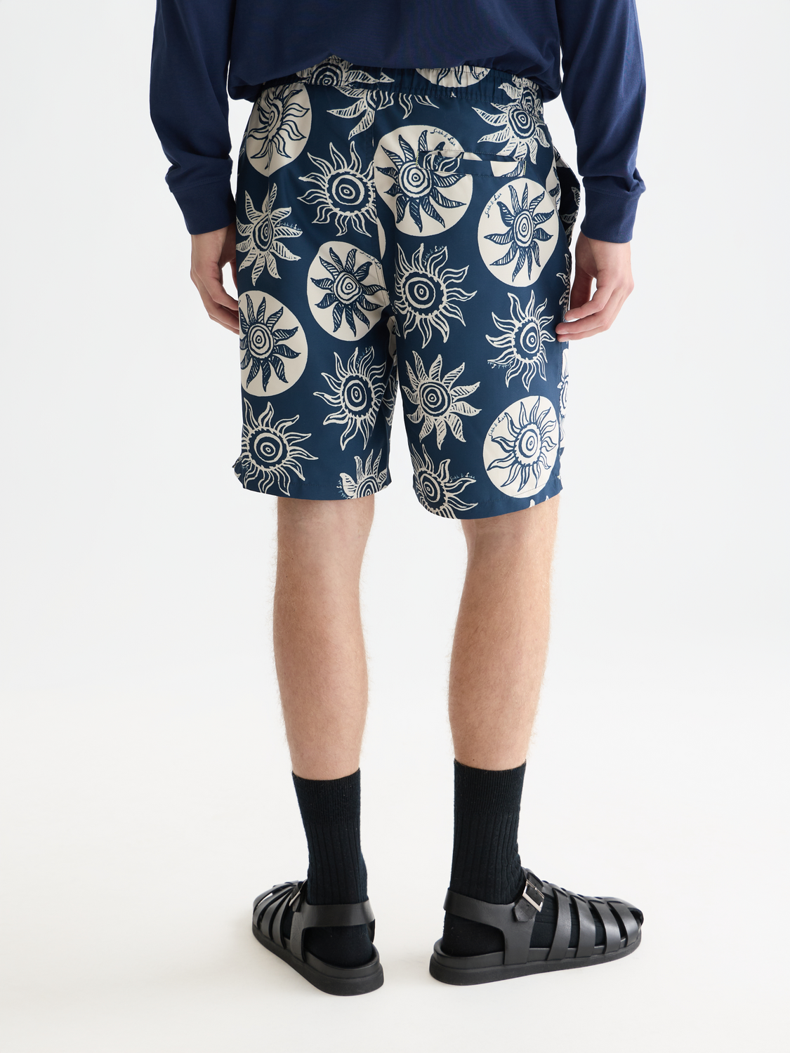 Printed SCOTCH & SODA swimshorts with vibrant pattern, shown from the back view on a white background.