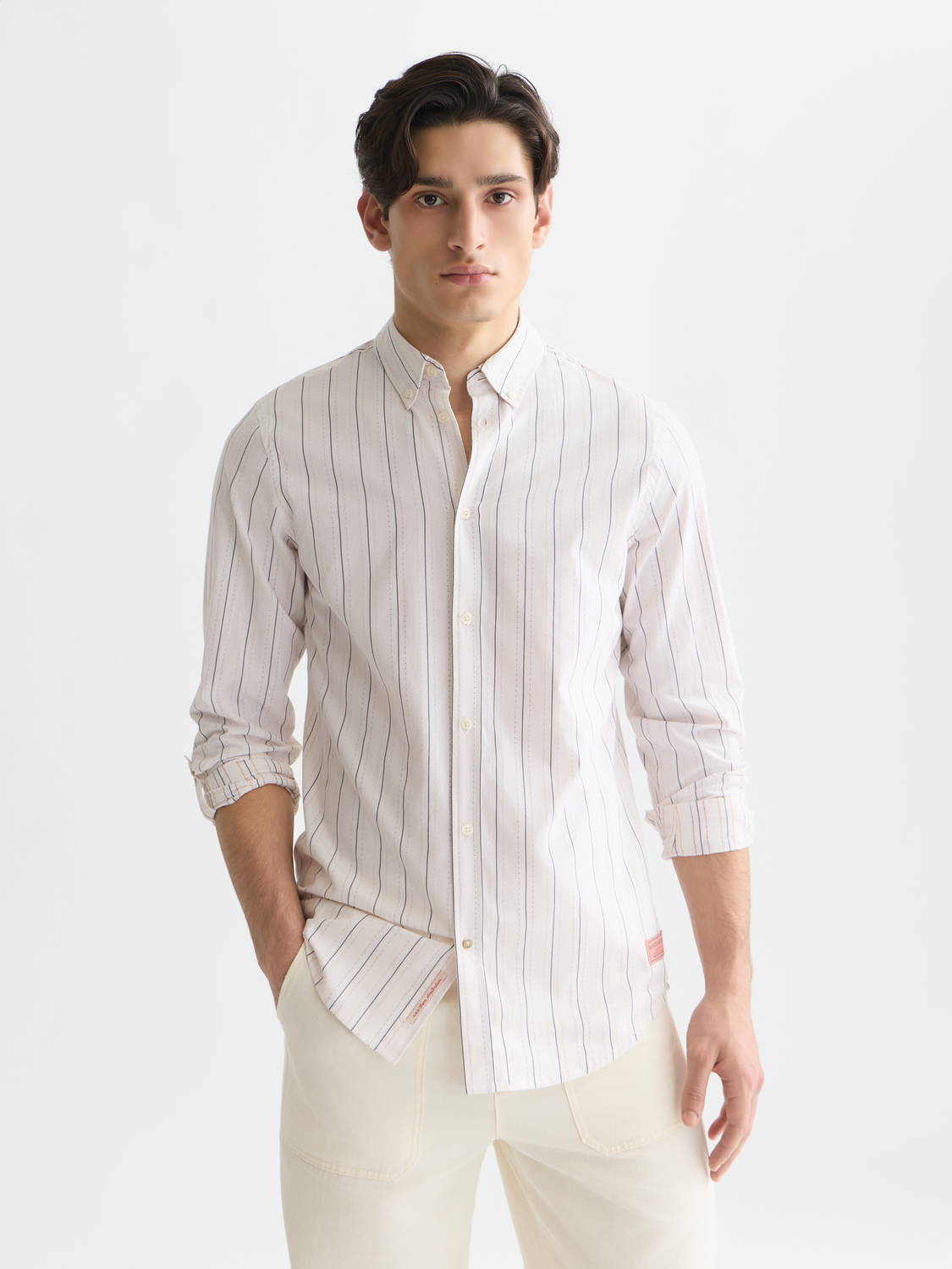 Long sleeve Dobby shirt by Scotch & Soda featuring intricate woven fabric and a classic fit, shown in a close-up view.