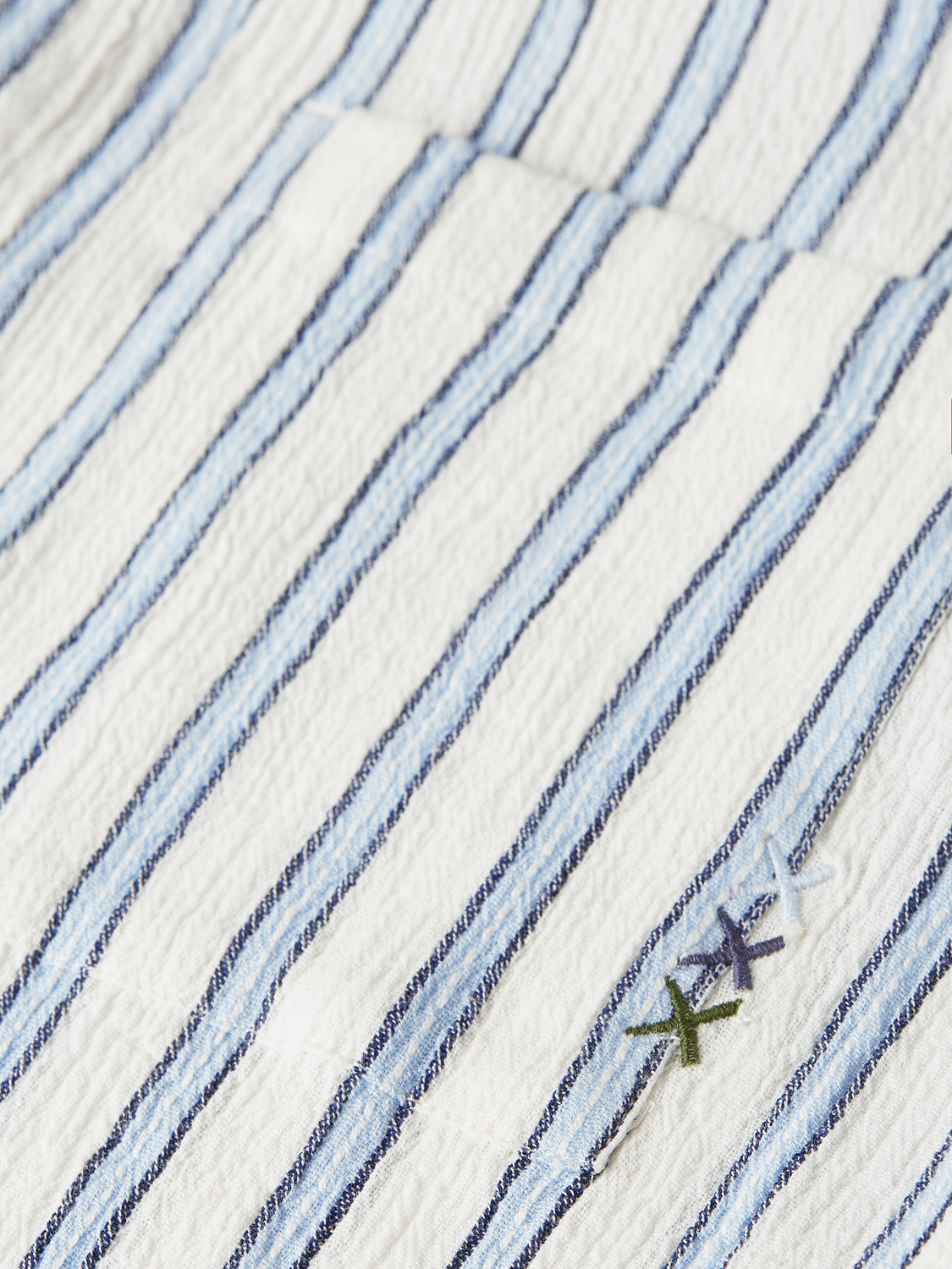 Long sleeve striped crinkle shirt by Scotch & Soda, showing a vibrant, lightweight fabric with a casual fit and button-front design.